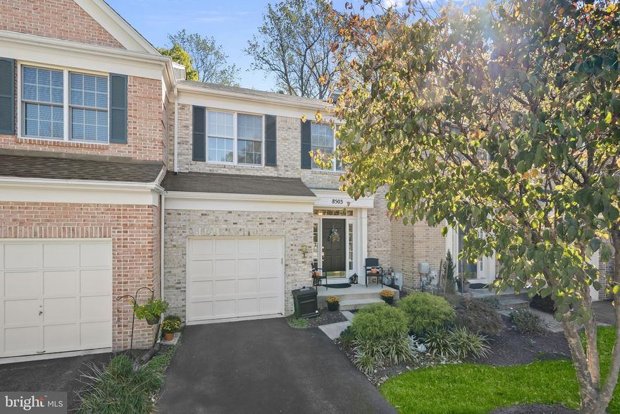 This beautifully appointed three-level brick-front townhome combines timeless design with a sought-after Ellicott City location. Set against a peaceful backdrop of mature trees, this residence offers the perfect balance of comfort, functionality, and convenience. A welcoming foyer opens to a spacious living room filled with natural light from the atrium door and transom window above. Elegant details such as crown molding, box wainscoting, and gleaming hardwood flooring flow throughout the main level, creating a cohesive and polished look. The separate dining room connects seamlessly to both the living area and kitchen, an ideal setup for entertaining or everyday living. The kitchen blends style and practicality with white cabinetry featuring roll-out shelves, granite countertops, stainless steel appliances including a gas range, and a pantry for additional storage. From casual breakfasts to evening gatherings, this space effortlessly adapts to any occasion. Upstairs, three inviting bedrooms each boast vaulted ceilings that enhance their open, airy feel. The primary suite offers a walk-in closet complete with a built-in organization system and a private bath with a skylight, double sink vanity, soaking tub, and separate shower. Two additional bedrooms share a full hall bath, while the conveniently located upper-level laundry room adds everyday ease. The lower level expands the living space with a sprawling family room featuring a cozy fireplace and wet bar, perfect for movie nights or hosting guests. A half bath and a utility room with storage complete this versatile level. Step outside to enjoy a serene backyard area that backs to trees, offering a peaceful retreat for outdoor relaxation. Additional highlights include a one-car garage with a driveway and nearby guest parking. The prime location places you just minutes from shopping, dining, and entertainment, as well as major commuter routes including US-29, I-70, I-95, and MD-100. Howard County schools, the Meadowbrook Athletic Complex, and the scenic trails of Patapsco Valley State Park are all nearby. Explore the charm of Old Ellicott City with its boutique shops, inviting restaurants, and year-round community events, all just a short drive away. Blending thoughtful updates with an unbeatable setting, this townhome offers the lifestyle and location you’ve been looking for.