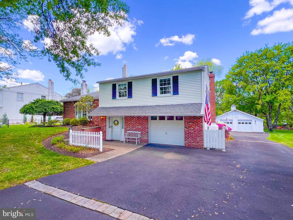 Welcome home to 51 W. Patricia Road! This unique split level has so many amazing features. As you walk into the home you're greeted by a sundrenched foyer. The entry level has a large family room with propane heated fireplace. The extra large laundry room has your dream space for a mud room with wet sink and cabinetry for storage. Walk up a few steps to the large living room with a wood burning fireplace. The dining room has a large bay window looking out over the large read yard. An updated kitchen has a breakfast room extension looking over the large serene yard. The large bay window and door off the kitchen to the patio allow a great flow through the entertaining area. The kitchen has lots of cabinet and counter space. A large breakfast bar allows you to sit in the breakfast room and intereact with the kitchen. A skylight in the middle of the kitchen floods the room with natural light. A few more steps up and you have 3 large bedrooms. Primary bedroom features an en-suite bath. Hall bath is roomy with a tub/shower combo and a linen closet. This home also has an unfinished basement under the kitchen level. The basement provides ample room for storage, workshop and play as desired. There is a 1 car attached garage off the laundry area of the home. Out back at the rear of the property is a large 2-3 car detached garage which is a car enthusiasts dream. Off the the family room is a screened patio for your relaxing days at home. More entertainment space flows off the screened patio to a deck area. Plenty of room for hosting a gathering! This home has so many interesting features that will delight you. Make your appointment now and call this beautiful property HOME!