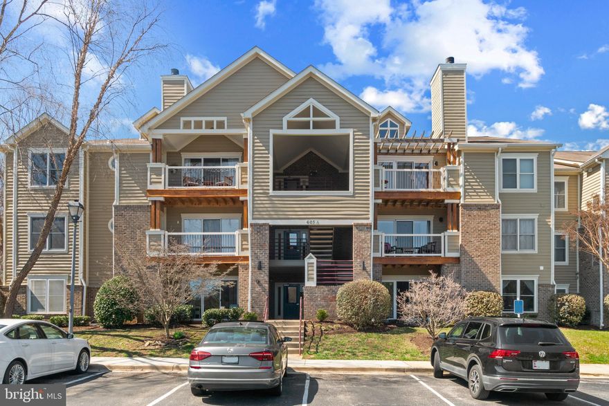 FIRST FLOOR 2 BR | 2 BA UNIT WITH DEEDED PARKING SPACE UNDER CARPORT. Just a few steps to this nicely maintained, private unit on main level that offers new windows and newer engineered hardwood flooring throughout, and roomy Living Room with wood burning fireplace leading to patio. Spacious Kitchen, Separate Dining Room, Primary Bedroom with full Bath including soaking tub and shower. Second BR with hall Bath.  Harbour Gates offers outdoor pool, fitness center, tennis courts and picnic area. Conveniently located to AAMC, Downtown Annapolis and all major highway routes. Secure building and same cul-de-sac as community pool. This one will go fast!
Professional photos coming later today.