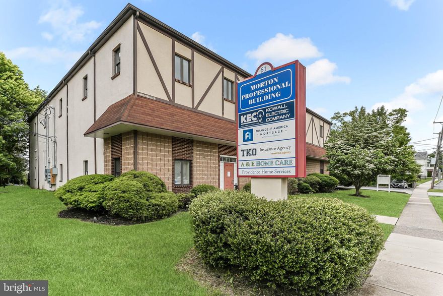 Strategic Commercial Asset in Morton Borough. Take advantage of this unique opportunity at the center of one of Delaware County’s most connected and accessible locations. This versatile 12,000 square foot professional office building offers a rare opportunity for owner-users or investors to secure a prime commercial asset in Morton. Located just steps from the Morton/Rutledge SEPTA station and minutes from Media Borough, I-95, and Center City Philadelphia, this property boasts excellent regional connectivity in a walkable suburban setting. Recently enhanced by a $500,000 rear expansion that added a brand-new elevator and stairwell, the building offers a blend of functional infrastructure and thoughtful modern upgrades. Zoned for commercial office use, the space is well-suited for a wide range of professional, medical, educational, or flex operations. With only one space under a continuing lease, much of the building is now available for immediate occupancy or re-lease, offering flexibility for both end-users and investors seeking value-add upside. The building includes six bathrooms, two of which are full baths, and one has been fully renovated. The wide hallways and updated systems provide an accessible, efficient layout. A private on-site parking lot accommodates over 20 vehicles, a highly valuable amenity in this submarket. Additional features include public utilities, central air conditioning, a rubber roof, and a stucco exterior designed for ease of maintenance. Whether you're planning a new business headquarters, a regional office expansion, or a repositioning investment, 61 S Morton Avenue offers the scale, infrastructure, and location to make it happen. Private tours are available by appointment. Don’t miss this opportunity to establish your footprint in one of Delaware County’s most strategically positioned boroughs. Sale includes two different parcel numbers at 61 S Morton Ave. Tax ID Numbers 29-00-00381-00 and 38-03-01701-02