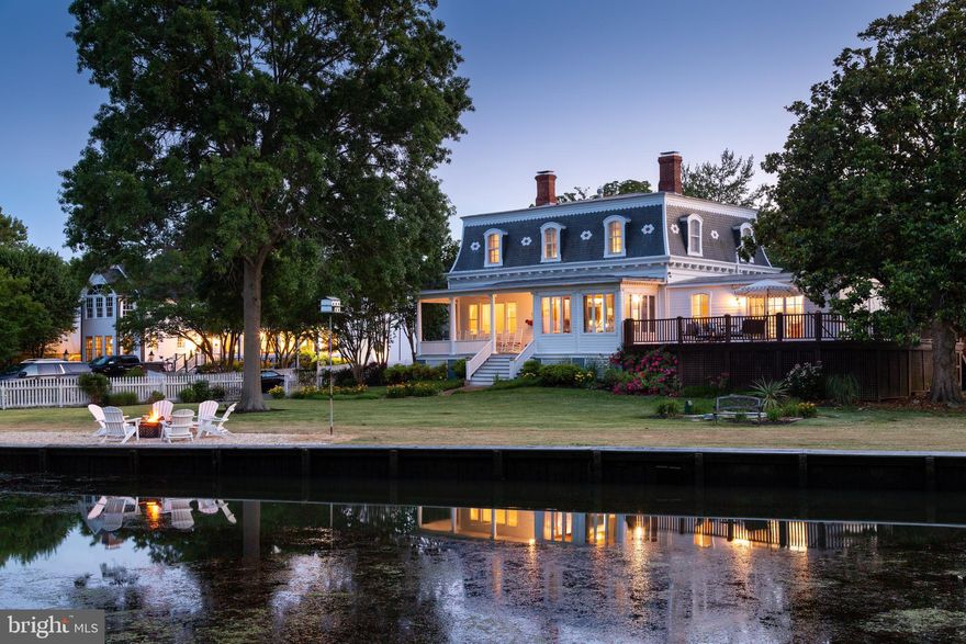 This prominent, Bed and Breakfast Inn, in historic St. Michaels, impresses with its nostalgic charm, Victorian architecture, and superior craftsmanship.  The Inn is beautifully situated on the largest waterfront lot in town, with views of Honeymoon Bridge, the renowned  Crab Claw Restaurant and the Patriot, a 65-foot touring vessel.  The Inn offers both a tranquil setting and a front row seat to the picturesque St. Michaels Harbor.  The Inn boasts 7 bedrooms,  8.5 bathrooms and 3 fireplaces.  In addition, the first floor (with cozy rooms and covered porches) offers ample space for gathering or relaxation.  There is also a 2-bedroom, 2 bath cottage on the property for the owners or managers of the Inn.  Ample guest parking is available on site.  This is a unique and wonderful opportunity to own an iconic property in historic St. Michaels.