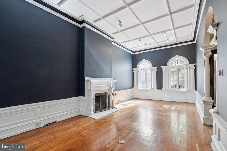 Set gracefully between the Rittenhouse Square and Fitler Square neighborhoods—on one of Center City’s most beloved, tree-lined residential streets—this stately historic townhouse blends timeless architectural grandeur with thoughtful, contemporary livability. Just steps from both Rittenhouse and Fitler Squares and within the highly regarded Greenfield School catchment, the home enjoys a serene, residential setting surrounded by classic brick and stone facades, all while being moments from the vibrant energy of downtown Philadelphia.

A gracious entry hall sets the tone, revealing high ceilings, original hardwood floors, detailed millwork, and tall windows that bathe each room in soft, natural light. The formal living and dining rooms retain the home’s historic scale and presence, offering elegant proportions for both daily living and memorable entertaining. Just beyond, a serving kitchen—distinct from the dining room—features granite countertops, sleek stainless-steel appliances, and wine refrigeration, while the dining room itself showcases leaded-glass windows, high ceilings, ornamental mantel, and crown moulding, preserving the traditional townhouse flow and architectural integrity.

On the garden level, a second, grand chef’s kitchen serves as a more casual gathering space and opens directly to the private rear garden—a rare and coveted indoor–outdoor connection in this neighborhood. A conveniently located powder room makes this floor ideal for relaxed hosting, weekend cooking, and everyday comfort.

The second floor features the primary bedroom suite at the front, complemented by a versatile rear room—perfect as a den, library, office, or sitting room—complete with a working fireplace, decorative mantel and easy access to a powder room on the same level. The home’s thoughtful layout allows these rooms to adapt beautifully to evolving needs.

The third floor offers two additional well-proportioned bedrooms, each with excellent light and storage, along with a full bathroom. At the top of the home, the fourth bedroom with an en-suite bath opens directly to a roof deck with exceptional skyline views—an inspired setting for morning coffee, quiet evenings, or fresh air above the treetops. A partially finished basement houses mechanicals and provides added storage and utility space.

Perfectly positioned in one of the most connected areas of Center City, this address offers exceptional access to every convenience. The University of Pennsylvania, Drexel University, CHOP, HUP, and Amtrak’s 30th Street Station are all nearby, as are the Schuylkill River Trail, parks, cafés, and an abundance of dining and shopping destinations such as Southgate, Ambrosia, Parc, and The Dandelion. With its outstanding access to public transit, bike routes, and pedestrian-friendly streets, the neighborhood makes getting around easy and enjoyable for all.

Elegant, warm, and deeply rooted in the architectural fabric of Center City, this home offers both presence and practicality—historic detail paired with the ability to live comfortably and beautifully every day.