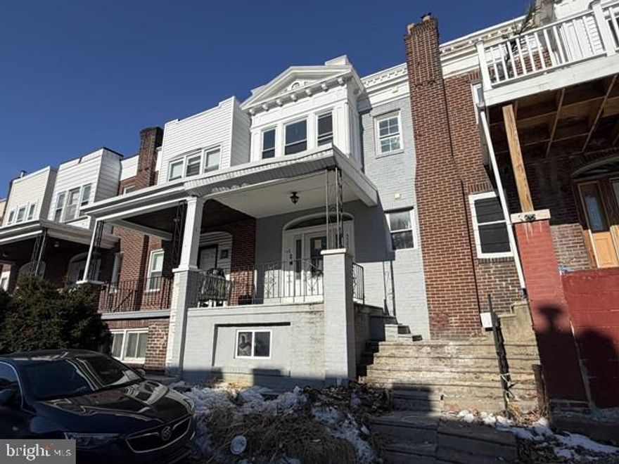 This three-bedroom, one-and-a-half-bath interior rowhome in West Philadelphia features an open first floor with combined living and dining spaces that flow into a kitchen with tile flooring and convenient rear deck access. Upstairs are three handsomely sized bedrooms and a full hall bathroom, and the unfinished basement offers walkout access to the rear yard, providing flexible storage or finishing potential. A covered front porch adds curb appeal and outdoor space. Conveniently located in the 19143 area near public transportation and close to the vibrant University City and Cedar Park corridors, residents enjoy easy access to Clark Park’s farmers market and recreation, neighborhood dining and shopping, and major routes connecting to Center City and beyond.