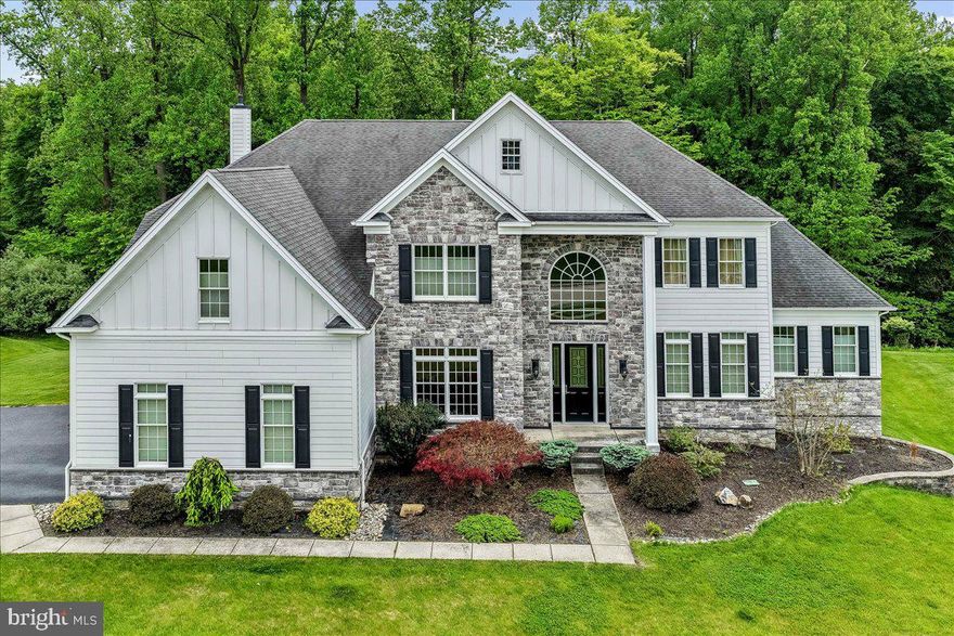 Highly Sought After Estates At Chadds Ford. Elegant Stone Colonial on Premium Lot that backs up to Open Space. 5 Bedroom 4.5 Baths. Enter the 2-Story Foyer with Curved Staircase, Elegant Living Room, Convenient Dining Room Adjacent to Kitchen Making Entertaining Easy, Gourmet Kitchen with Granite Countertops and Stainless Steel Appliances, 2-Story Family Room with Wall of Windows and Gas Fireplace, Convenient Study, Laundry Room and Powder Room. First Floor In-Law-Suite with Bedroom and Full Bathroom. Upstairs – Large Primary Suite with Sitting Room, Large Custom Closet and Elegant Primary Bath with Jacuzzi Tub with Adjacent Sinks and Shower. Second Bedroom with Ensuite, Third and Fourth Bedroom with Shared Bath. The Back Yard Area is Amazing with Tri-Level Deck, Screened Porch and Gazebo. The Yard backs up to Wooded Open Space which is very Rare in this Community. Full Walk-Out Basement, 3 Car Oversized Garage with Driveway Parking. This Home Is A Must See. Conveniently located just moments away from Delaware Tax Free Shopping Centers, Dining Options, Recreational Parks, & Renowned Schools.