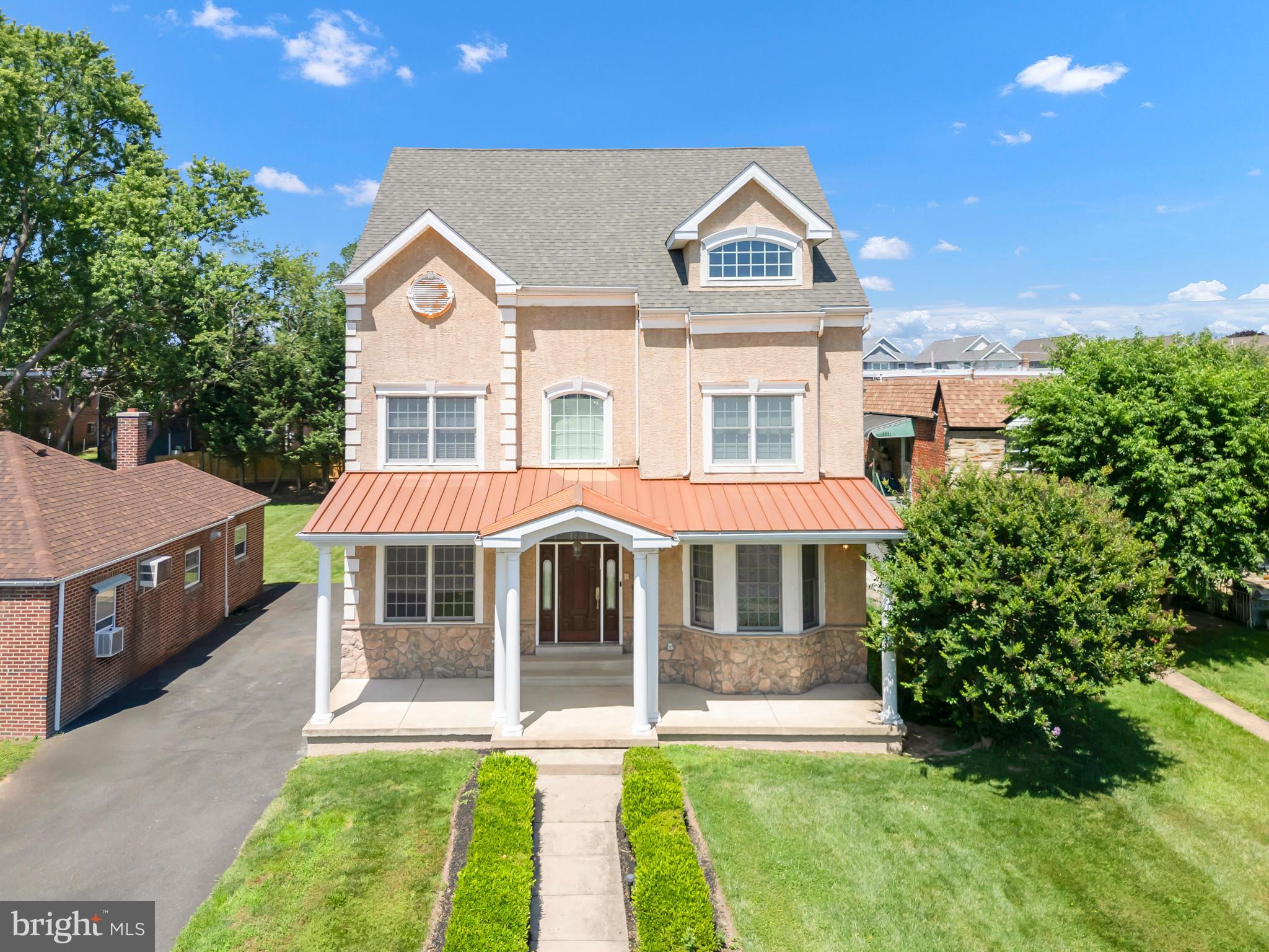 Introducing a rare opportunity in the heart of Rhawnhurst, Northeast Philadelphia—an exceptional 8-bedroom, 5.5-bath custom home set on a coveted double lot. Built in 2005 by a real estate developer as his personal residence and offered for the first time, this expansive property showcases over 8,500 square feet of beautifully finished living space, blending enduring craftsmanship with remarkable scale.
The main level welcomes you with a gracious foyer and elegant hallway, leading to an inviting living room, a private study, and an expansive formal dining room, fitted with stunning hardwood floors and designed for entertaining on any scale. At the heart of the home is a chef’s kitchen appointed with abundant cabinetry, a panel-ready Sub-Zero refrigerator, three ovens, two cooktops, and a spacious center island—perfect for both everyday living and grand gatherings. The main level also features a comfortable family room, providing an ideal setting for relaxation. Downstairs, the fully finished lower level offers incredible versatility, complete with a kitchenette—perfect for extended family, guests, or entertaining. Upstairs, the second floor hosts five generously sized bedrooms and three full bathrooms, highlighted by a sprawling primary suite featuring a spa-inspired bath for ultimate comfort and luxury. The third floor presents a large, open loft space with sweeping views of Center City, along with three additional bedrooms—ideal for a variety of lifestyle needs, from home offices to guest quarters. Step outside to enjoy the large backyard, where you’ll find a Trex deck perfect for al fresco dining, entertaining, or simply unwinding in a private outdoor setting. Ample driveway parking and beautifully landscaped grounds further enhance the appeal of this distinguished home. Additionally the home features Andersen Windows , a central vacuum system, multiple HVAC zones and many more features to name. This is a rare opportunity to own a truly unique residence offering unmatched size, privacy, and location—just minutes from schools, parks, shopping, and everything Northeast Philadelphia and nearby Montgomery County has to offer. Schedule a private tour today!