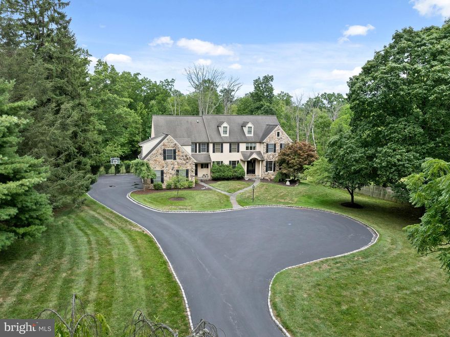 Nestled in the heart of Berwyn, this magnificent property at 533 Newtown Road offers an unparalleled blend of elegance, luxury, and comfort. Spanning just under 2 acres of lush, meticulously landscaped grounds, this residence exudes a welcoming presence from the street, with grand stone pillars and a Belgium block driveway that leads you to the front entrance. The First Floor welcomes you with gleaming hardwood floors throughout, leading to a stunning front-to-back Foyer, flanked by formal Living and Dining Rooms that set the tone for refined entertaining. The Living Room features a cozy fireplace, creating a warm and inviting atmosphere. The open floor plan flows seamlessly into the heart of the home, featuring a spacious Great Room with soaring ceilings, another fireplace, and expansive windows that provide streaming natural light, perfect for relaxing evenings or lively gatherings. This central space connects effortlessly to the gourmet Kitchen, designed for the culinary enthusiast with top-of-the-line appliances, custom cabinetry, and a large island. French doors lead directly from the Kitchen to the expansive Deck, offering a seamless transition to outdoor living. The Main Level also includes two Powder Rooms—one formal and one informal—providing convenience and versatility for both guests and daily living. Additionally, a well-appointed Office offers a quiet space for work or study, making it ideal for today's lifestyle. A Mudroom, conveniently located with direct access to the three-car Garage, adds to the home's functionality and provides an organized space for everyday essentials. A gracious staircase leads to the Second Floor, complemented by additional back stairs off the Kitchen for added convenience. The Upper Level features a total of five Bedrooms, including a luxurious Primary Suite. The Primary Suite is a sanctuary of comfort and elegance, featuring a private sitting area, walk-in closets, and a spa-like ensuite bath with a soaking tub, double vanities, and a glass-enclosed shower. Two additional Bedrooms are ensuite, offering privacy and convenience, while the other two Bedrooms share a well-appointed Jack and Jill bathroom, perfect for family members or guests. The walk-out Lower Level of this estate is an entertainer's dream, featuring a stylish bar, a dedicated wine room for the connoisseur, and a fully equipped exercise room for fitness enthusiasts. A separate area designed for watching movies provides a cozy retreat for cinematic experiences or casual lounging. This level also opens to a beautiful Patio, seamlessly blending indoor and outdoor living spaces. Step outside to discover a serene outdoor space, complete with a spacious deck and patio, perfect for enjoying the lush surroundings and fresh air. Whether you're hosting a summer gathering or enjoying a quiet morning coffee, these outdoor areas offer the ideal settings for relaxation and entertainment. Located in the highly sought-after Tredyffrin/Easttown School District and just minutes from many  dining options, shopping, and major highways, 533 Newtown Road offers the perfect blend of suburban tranquility and urban convenience. Experience the epitome of luxury living in Berwyn. Showings begin Wednesday July 31st....Schedule your private tour today and discover the timeless elegance and exceptional craftsmanship that define this extraordinary property!!