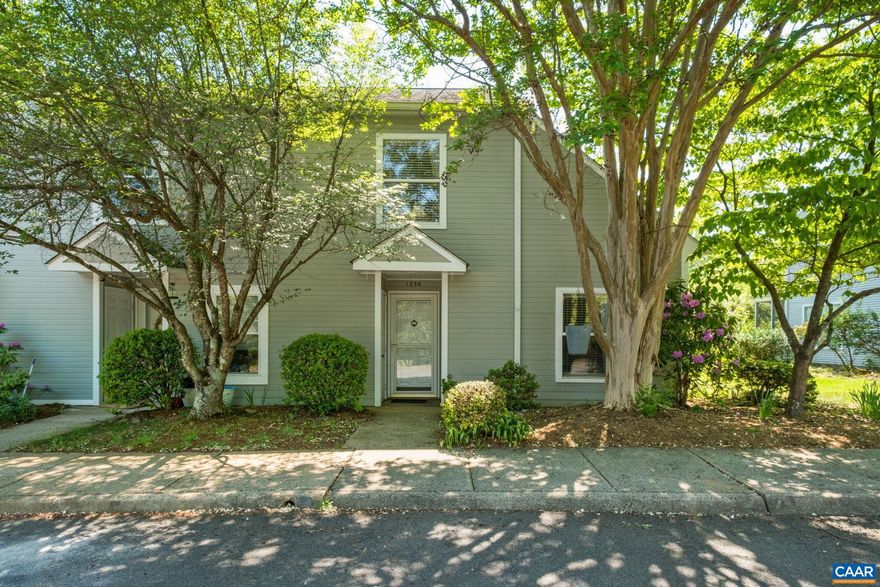 Welcome home to 1256 Maple View Dr, a charming end-unit townhouse nestled in one of Charlottesville's most desirable locations. This beautifully appointed 3-bedroom, 2-bathroom residence offers the perfect blend of comfort, style, and convenience. Inside, discover gorgeous hardwood floors flowing throughout, creating a warm and inviting atmosphere. The main level features a versatile bedroom, ideal for guests or as additional flexible space, alongside a cozy fireplace flanked by elegant built-in shelves, perfect for showcasing your favorite reads and treasured collections. Upstairs, two spacious bedrooms provide peaceful retreats with breathtaking mountain views that transform every morning into something extraordinary. The kitchen shines with sleek stainless steel appliances, making meal preparation a genuine pleasure. As an end unit, you'll enjoy additional natural light and yard space perfect for gardening. Location is everything, and this home delivers. Minutes from the scenic Carter Mountain, Piedmont Virginia Community College, and Wegmans for everyday essentials. The Downtown Mall's vibrant dining and entertainment scene and the University of Virginia are just a short drive away, and convenient access to Interstate 64.,Quartz Counter,Wood Cabinets,Fireplace in Living Room