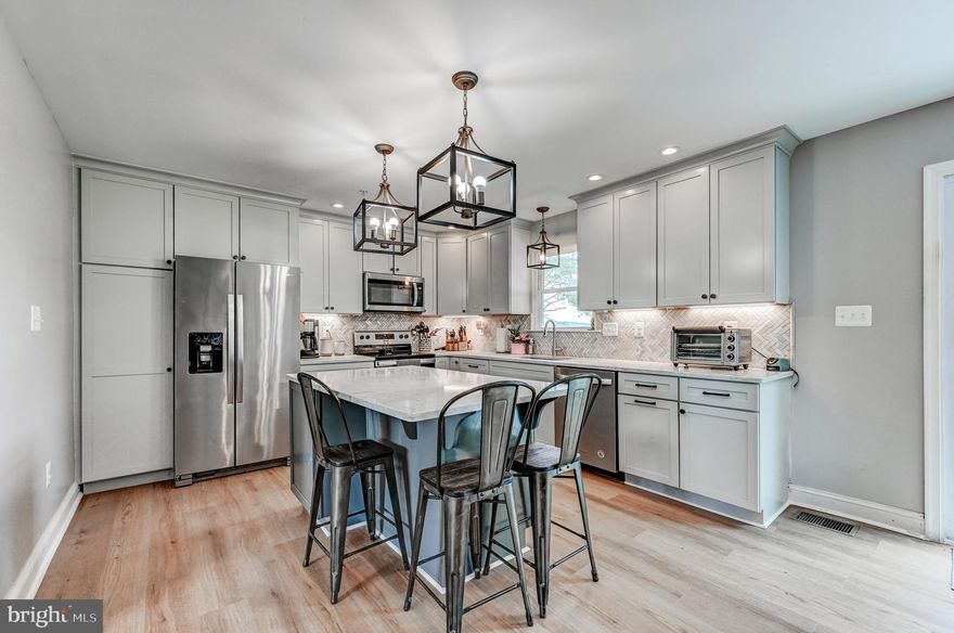 This is the ONE you've been waiting for!!!  Flat and Open 1.35 Acre Lot with a Country Setting backing to Farmland!  Stunning Full Luxury Renovation within the past 5 years!  Everything is modern and updated, including:  2 Zone Central Heating & Air system (important for Cape Cods), sprinkler system, all appliances, roof, gutters, siding, electrical, plumbing, patio, and more; everything new within past 5 years! Large First-floor primary suite w/ custom shelved walk-in closet, full bath w/ dual vanities and shower stall , powder room off the living room, brick wood burning fireplace, spacious and well lit custom designed kitchen and dining area with slider out to rear, and first floor laundry with built-ins. The upper level boasts 2 bedrooms and a large full bath. The basement is finished with a big open Family Room, Bonus Room / Bedroom, and storage area. Extra-wide driveway offers tons of parking and leads up to a large two car garage.  Patio off Kitchen that leads to a huge open and flat backyard which is perfect for BBQ's / Kids / Pets / Entertaining.