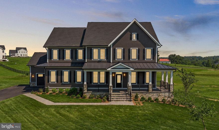 Move right into this brand new, stunning new-construction residence, perfectly situated on 3.07 acres within Waterford's exclusive Glenmore Farm community. VanMetre meticulously crafted this gorgeous home, sparing no expense on custom luxury details. Enjoy the superior strength and efficiency provided by 6" exterior walls, complemented by high-end finishes, GE Cafe appliances, and Anderson windows and doors.

This 6-bedroom, 6.5-bath home offers 4 finished levels and 6,717 sq ft of beautifully designed living space. The main level features 10-ft ceilings, wide-plank engineered hardwood flooring, extensive trim detail, and an open layout that includes a large open concept living area with a gas fireplace and a dedicated dining space off the kitchen.

This residence features a Designer Kitchen that is as visually stunning as it is functional,  centered around a suite of GE Café white stainless gas appliances. Culinary enthusiasts will appreciate the impressive six-burner GE Café range with griddle and hood, complemented by a GE Café™ smart built-in wall oven. The aesthetic is defined by elegant contrast: the surrounding custom cabinetry is crafted from white oak, while the substantial island features tan white oak, all designed with soft-close drawers and adorned with sophisticated honey bronze hardware. The white brick backsplash pairs beautifully with the opulent Calacatta Elysio quartz countertops. Completing this luxurious workspace are a classic Kohler Whitehaven® farmhouse cast iron undermount sink and the distinctive touch of a Kohler Artifacts® vibrant brushed brass pot filler.  The kitchen area is completed by a large walk-in pantry, and a butler’s pantry for added storage, prep, and entertaining space.

The upper level includes a spacious primary suite with a private covered porch, two walk-in closets, and a spa-inspired bath with freestanding tub, oversized shower, and custom wood vanities. Secondary bedrooms each include en-suite baths. A fourth-floor loft offers a unique space for a home office, lounge area, music room, kid zone, or whatever your mind can dream up.  There is a full bathroom to complete this 4th level space.

The finished walk-out lower level features a large recreation room with gas fireplace, media room, full wet bar with GE Café appliances, bedroom, and full bath. Outdoor living includes a Trex deck, connecting stairs, and a flagstone patio overlooking open acreage.

Additional features include James Hardie siding with stone accents, Andersen windows, Thermatru doors, a 3-car side-load garage, ENERGY STAR-qualified mechanicals, zoned HVAC, a water treatment system, and landscaped front and rear yards. Located on a quiet cul-de-sac within Glenmore Farm with convenient access to Waterford, Purcellville, commuter routes, and local amenities.  Come see this amazing home before it's gone!
