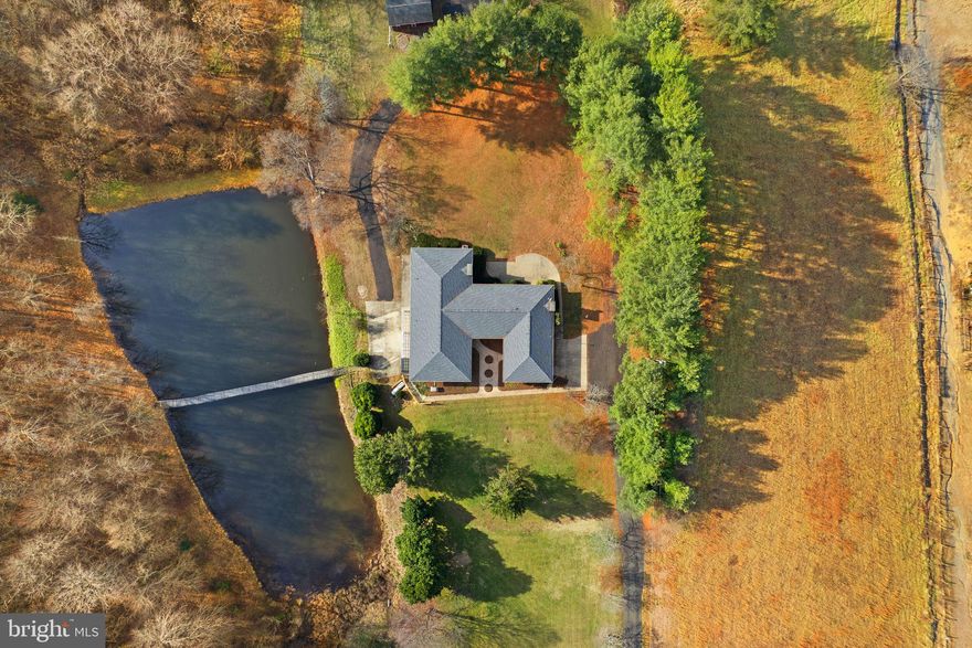 An incredible 11.4-acre estate with spectacular mountain views, with its own pond, in the beautiful Rappahannock County. Ideal for farming, homesteading, equestrian, recreation, or a private estate. No HOA. High-speed internet is already wired and ready to be active.          

The residence is thoughtfully designed with multiple independent living areas, making it well-suited for multigenerational living, extended family arrangements, or potential income production. The home features the main-level areas of vintage European‑inspired elegance with solid oak floors throughout, Italian tile, two fireplaces, all in an expansive space with its own full kitchen and laundry room, 5 large BR/3 full BA. While the lower level offers a renovated living area, including a gigantic bonus room 46ft x 25ft, in addition to a huge storage room, all with a 2nd full kitchen, its own laundry room, 2 large BR/1 full handicap accessible BA, its own entrance and parking pad.  Only cosmetic updates are needed.  Space to add more rooms!        

Recent improvements provide peace of mind, including Roof (2019), Water Heater (2022), Kohler Backup Generator (2023), Septic service completed (2023), Chimney inspected (2023), Lower‑Level W/D (2024), Certified Oil Tank inspected (2025), A/C unit and furnace (underway to be replaced soon). Owned propane tank.          

Outdoor amenities elevate the property's appeal: fish-stocked pond, established garden area, and a multi‑purpose barn/garage/shed ideal for vehicles, workshop or tools, storage.          

Perfectly situated along the Rappahannock-Culpeper county boundary, this expansive property offers a rare opportunity to own a significant piece of Virginia’s most desirable countryside. Just 15min away from the Warrenton, Route 29 corridor, and the thriving Clevenger's Corner area.  Also nearby is a world-class dining in Little Washington, the artistic charm of Sperryville, and the natural wonders of Shenandoah National Park; the best of the region is at your doorstep. From local wineries and craft breweries to premier golf courses, recreation is endless—all while remaining a manageable 90-minute drive from the heart of Washington, D.C.          

This versatile acreage is a blank canvas for your vision, featuring essential water access and ample space for livestock or crops. With plenty of room for future structures, the land provides both immediate utility and long-term flexibility. This is more than just a private oasis; it is a strategic investment with genuine income potential in a high-demand rural market. Secure your future with a property that offers the perfect balance of seclusion, connection, space, and accessibility.