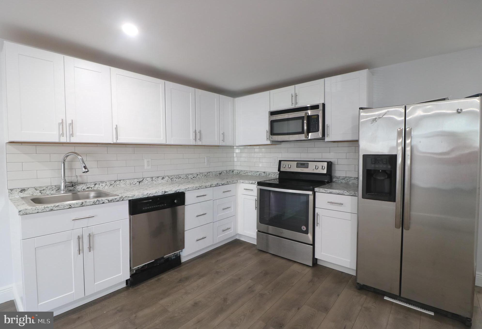 Don't miss this incredible opportunity! This fully renovated double-wide mobile home offers a unique and versatile layout with two separate additions, each featuring its own kitchen, bathroom, and washer/dryer—a perfect opportunity! With a total of 5 bedrooms, one of which could be used as an office or nursery, this home provides plenty of space to fit your needs. Enjoy 8+ foot ceilings throughout, insulated siding, a brand-new furnace, and two separate electrical panels in each unit for added efficiency and convenience. The private driveway fits three vehicles, with additional street parking available. This gem is located in Williams Estates & Peppermint Woods. Please contact the parks office directly to know the exact ground rent number, (Ranging from $1,030-$1,090 a month).Golden opportunities like this don’t last long—start your pre-qualification process today!