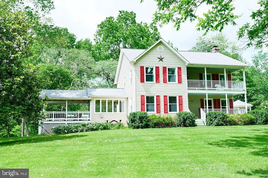 10 acres of peace and serenity await you.  This charming home offers three bedrooms and 2.5 baths along with a covered front porch, front balcony, and rear balcony off of the primary suite.  An updated primary bath, engineered hardwood on the main level, quartz countertops in the kitchen, new upstairs carpet,  and newer HVAC / water heater allow for peace of mind.  A private stocked pond and putting green offer entertainment in addition to the rest of the grounds. Active garden boxes offer a variety of flowers and vegetables and a detached two car garage provides storage for vehicles and / or toys.  A three season room and deck provide more outdoor living space! This home is unique and offers fantastic living!