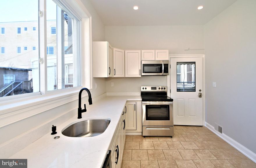 Experience vibrant downtown living in this beautifully updated 2-floor apartment, ideally located just steps away from the iconic Colonial Theater and surrounded by Phoenixville’s best shops and restaurants. Enter through a private entrance into the first floor, featuring soaring ceilings, sleek recessed lighting, and a modern kitchen equipped with new cabinets, countertops, stainless steel appliances, and an in-unit washer and dryer. The second floor offers a spacious living room,  bedroom, and an updated full bathroom. An additional entrance on the second floor provides convenient access to the main building from Bridge St. Enjoy the charm of refinished hardwood floors on the stairs and throughout the upper level. Water, sewer & trash are included.  1 small dog on a case by case basis with an additional fee.