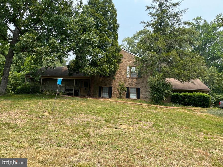 FIRST TIME ON THE MARKET! LOCATION AND OPPORTUNITY! THIS TRI-LEVEL HOME IS A DIAMOND IN THE ROUGH WITH AMAZING POTENTIAL.  LOCATED ON 5+ ACRE WOODED LOT THIS COULD BE YOUR RETREAT TO ENJOY WITH AN EASY COMMUTE TO ALL THE METRO AREAS.  A SECLUDED AND PRIVATE LOT WITH PLENTY OF SPACE FOR ENTERTAINMENT WHICH OFFERS THE BEST OF THE RURAL VIRGINIA COUNTRYSIDE AND ACCESS TO THE METRO AREA. ALL BRICK/STONE EXTERIOR. ATTACHED 2 CAR SIDE LOAD GARAGE WITH ADDITIONAL DETACHED GARAGE. THE INTERIOR HAS AMPLE SPACE WITH 4 BEDROOMS, 3 BATHS, FORMAL LIVING ROOM, FAMILY ROOM, AND DINING ROOM.