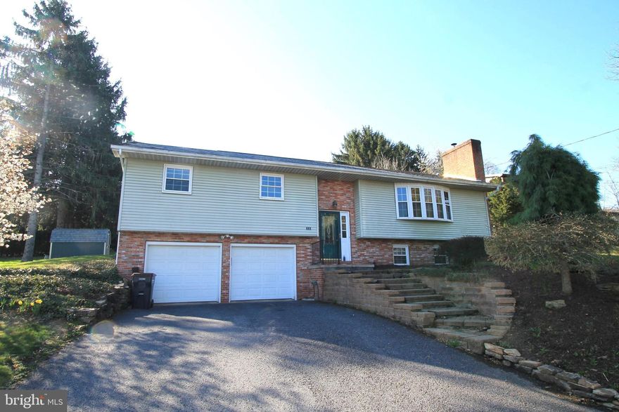 Welcome to this charming split-entry home offering 3 bedrooms and 2.5 baths. The main level features a spacious living room with gleaming hardwood floors, a cozy wood-burning fireplace, and a beautiful bay window that fills the space with natural light. The open-concept kitchen boasts warm wood cabinetry and flows seamlessly into a large dining area with direct access to a generous back deck, perfect for entertaining or enjoying quiet evenings outdoors. The main level also includes a primary bedroom complete with a full ensuite bath, two additional bedrooms, and a full bath. Downstairs, you’ll find a large bonus room warmed by a pellet stove and enhanced with natural light, ideal for gatherings and relaxation. There’s also a dedicated craft room, a convenient half bath combined with the laundry area, and an additional bonus room. Enjoy the convenience of a large 2 car garage. This home combines comfort, functionality, and charm in a lovely setting. Schedule your private tour today!