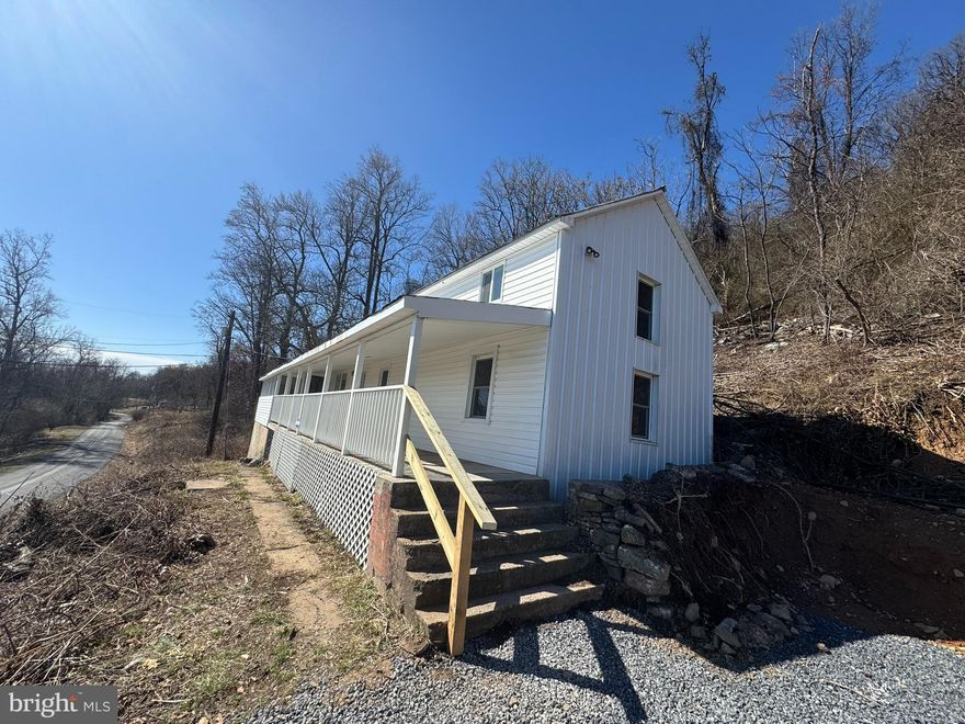 This recently renovated rental features a large covered porch and screened porch on the front of the home. Perfect place to take in the mountain views. Inside you have a spacious living room with bright windows and easy-care laminate floors.  Beyond this you have the great room with vaulted ceilings. It flows seamlessly into the spacious kitchen. Here you have updated appliances and ample cabinet space.  Beyond the kitchen is large mudroom with laundry hook-ups. There is a large bedroom with carpet on the main floor of the home. It includes lots of windows for tons of natural light. There are two spacious bathrooms with single bowl vanities and tub/showers. Up the stairs you have a large loft area. This could be used as an office, playroom, or third bedroom if desired. Bedroom number 2 is upstairs as well with lots of windows and great views. This home has the space you're looking for with beautiful views. The owner will install laundry machines for an additional $50 in rent. Call for more information today!