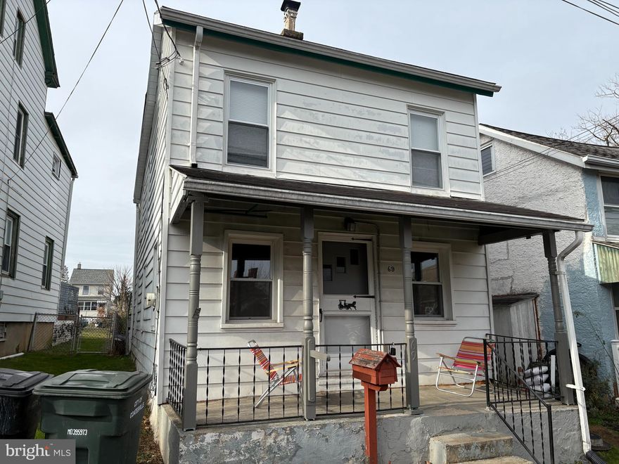 Welcome to this lovely home. It includes a cozy living room and a large kitchen on the main floor. The upper floor has two bedrooms an an open area that could be used as a play area, storage or office area. This is a turn key rental property with a good quality tenant in place. Rent is $1435 and tenant pays all utilities. Lease runs through July 2026. Palmer is  not a thru street so far less traffic. The rear yard is large with a paved driveway and gate.