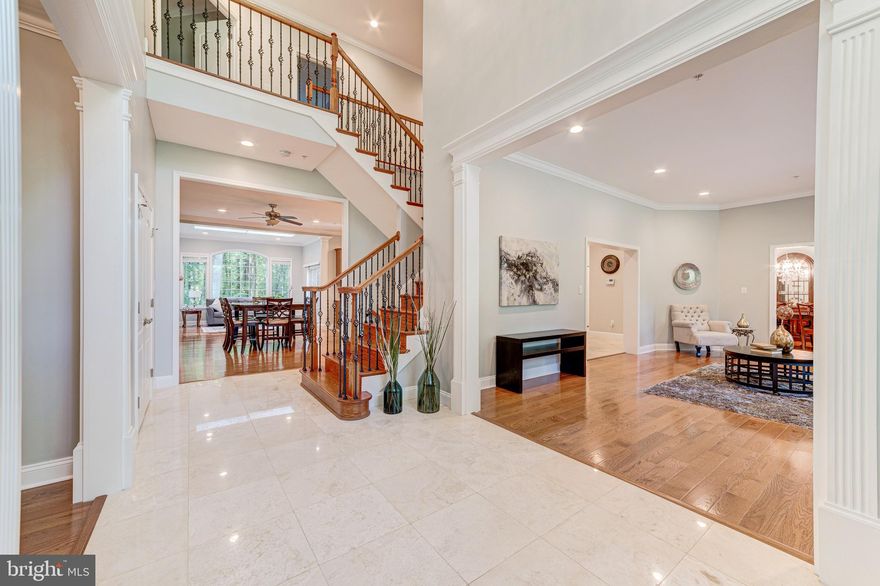 Priced to sell!  Luxury living awaits you in over 4800 square feet plus 1794 square feet basement in the heart of Potomac!  Completely reconstructed in 2014!  This 4BR / 5.5 BA home with a 3 car garage is truly an entertainer s dream, inside and out.  Walk through a stunning 2 story foyer with Travertine tiles into a spacious open kitchen with 6  burner high-end Therm-adore gas stove and beautiful granite counter  tops with with Vac-Pan, family and morning room with breathtaking views.  Upstairs has a grand master bedroom with sitting room, TWO walk-in closets & craft closet, with a glorious master bathroom.  Enjoy a beautiful outdoor yard with a stone patio on nearly an acre lot.  Work at home in a separate office or use it as a den. Main level bedroom with full bath.  Laundry room on upper level. House has Central Vac throughout & vac pan in kitchen. Finished lower level with wet bar adds more space to enjoy with media room, rec area, full bath, and additional storage areas. Main and upstairs hardwood floors.  In the heart of the desirable Churchill school district, minutes from Montgomery Mall, I-270, and Potomac Village. NO HOA FEES.  visit:10105BevernLane.C21.com .  To view Unique Property Site, please visit:10105BevernLane.C21.com