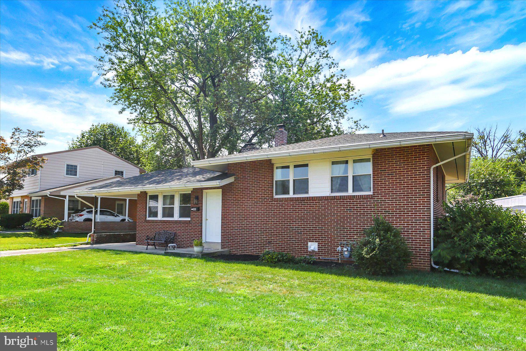 Welcome to this stylish brick split-level home that blends modern updates with timeless charm. Inside, gleaming hardwood floors flow throughout the spacious layout, highlighted by a bright and airy living room with a beautiful brick fireplace..
The modern kitchen is designed for both function and style, featuring granite countertops, newer cabinetry, and stainless steel appliances. A large recreation room on the lower level includes a full, tiled bathroom and walkout access, offering flexible space for entertaining, a home office, or a guest suite.
Upstairs, you’ll find three generously sized bedrooms, each providing comfort and natural light. The home also includes a driveway, carport, and a large, flat backyard—ideal for outdoor living, play, or gardening.
With its spacious design, walkout lower level, and prime location in Mechanicsburg Borough, this home is the perfect combination of modern chic and everyday comfort.