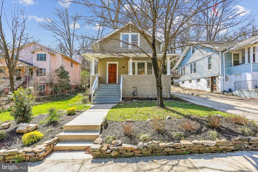 Captivating Arts & Crafts Bungalow in the sought-after Historic District of Takoma Park that's a short stroll to the downtown restaurants and stores but just 0.6 of a mile from Takoma  Metro Station.   The superb location is improved by being on a low-traffic street with off-street parking for 2 cars and on a big 0.20 of an acre lot.  The old-fashioned full-width porch welcomes you with a swing to enjoy the breeze from. Inside wood carved in a tradesperson era, long gone, greets you - the wood banisters and wood floors stick in your memory.  It's a sizable foyer where you can greet guests and tradespeople without having the whole house on display.  The living room, dining room, and library are each a separate room but connected by open spaces and lots of windows - so bright and airy all the way through this lovely home.  The kitchen is comfortable, not new, but the cabinets and counters are where you need them and the gas stove, refrigerator, and sink form a good triangle for efficient cooking.  An old-fashioned pantry may make you want to start jam and chutney-making again. What's not to like about a two-story addition that brings a super light family room with hardwood floors onto the floorplan and a 2nd set of connecting stairs to the upper level.  In between all of the excitement is a full bathroom with custom tilework and a big walk-in shower.  This home has great main-level flow whether you like casual fun or something more formal. It will work for you. Fresh paint throughout the two levels with varied colors and tones keeps things interesting too.  Come up the front formal wood stairs and two good size bedrooms with ornate curves and nooks and crannies greet you.  The hall bath here is updated with a new sink, floors, and lights.  The claw foot tub is great for soaking away the aches and pains.  Move on into the sitting room that doubles as a great office space and provides closets for the additional bedroom that is large, luminous, and warming.  That sitting room has space for an owner bathroom suite to be installed there if you are so inclined. 
The basement is not a showpiece, but it has a huge hobby room and a big office with a level-to-ground entrance beside it that makes for a potential home office that does not need visitors to trapse through the house. It can also double as a guest room.  There's cold storage underneath the front porch here too with lots of room.  A big laundry area and a small utility area finish off the basement.  
The garden is big but manageable with trees and a climbing set in the rear and a small water feature at the side.  The front has a Maple tree that burns gold and fire in the Fall and will be your enjoyment for years to come as it grows older.  
Gas-fired hot water heating and a gas hot water heater are complemented by a brand-new Central Air System. 
This warm and glowing home brings immediate joy.  It's well-sized but not huge spaces, winter light, and summer shade are all rolled into an adorable Bungalow on one of the best blocks in the City.  It's not to be missed!