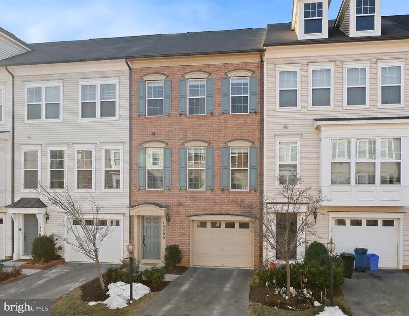 AMAZING NEW PRICE - Stunning Miller & Smith Brick-Front Townhome in Prime Clarksburg Location!
Welcome to 13205 Uffizi Lane, a brick-front, like-new, freshly painted Miller & Smith-built townhome offering 1,908 square feet of stylish living space. This beautifully designed home features three spacious bedrooms, two full baths, and two half baths, along with a one-car garage, and an additional parking space--plus a finished, walkout lower level showcasing hardwood floors and recessed lighting. There is also a convenient half bath and laundry closet with full sized washer and dryer.
Step inside to find hardwood floors throughout the lower and main levels, including the stairs, and an open-concept main level, perfect for modern living. The expansive granite center island kitchen offers seating for several barstools and boasts chic espresso cabinetry, espresso-colored hardwood flooring, stainless steel appliances, gas cooking, granite counters, recessed lighting, and space for a large kitchen table. Sliding glass doors lead to a sunlit deck, ideal for outdoor relaxation. A main-level powder room adds extra convenience.
Upstairs, you'll find three generously sized bedrooms, including a luxurious primary suite with a walk-in closet and a spa-like bath featuring a double vanity and oversized shower.** A **hall bath** serves the two additional bedrooms.
This home is located just seconds from the Clarksburg Premium Outlets, where you'll enjoy shopping at top retailers like Nike, Coach, Michael Kors, Under Armour, and Saks OFF 5TH. Plus, with I-270 just moments away, commuting is a breeze! Along with a one-car garage, there is an additional parking space, and a guest parking pass.
Don't miss this incredible opportunity—schedule your private tour today!