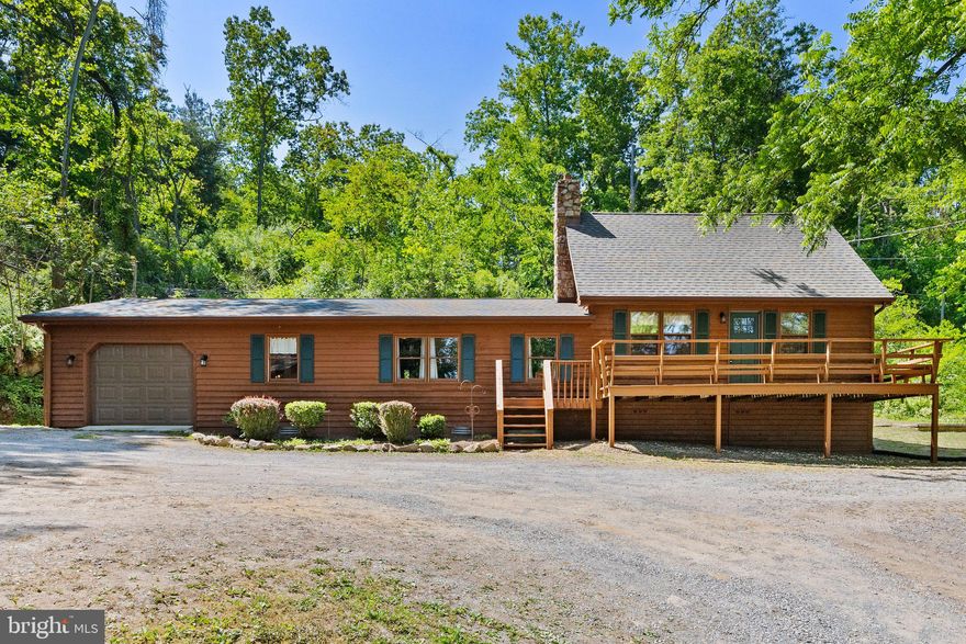 Your dream home awaits.  From the moment you drive up to this beautiful property, you will notice the love and care that this home has been given over the years.  The exterior of the home is immaculate and features a new roof.  Located in the Capon Bridge Resort development, this home features 4 bedrooms and 2 full baths.  The spacious family room is warm and inviting with a stone hearth and woodstove.  The large space off of the kitchen is perfect for dining or more living space.  There is more than enough storage in the attached 1 car garage or the over-sized detached garage.  The icing on the cake is the outdoor space. The lot is well manicured and shaded with mature trees.  Finally, enjoy all that the community has to offer including private access to the Cacapon River, Edwards Run Wildlife Management Area (500 acres of public hunting & hiking) and a gorgeous 3 acre stocked community lake for fishing and swimming.