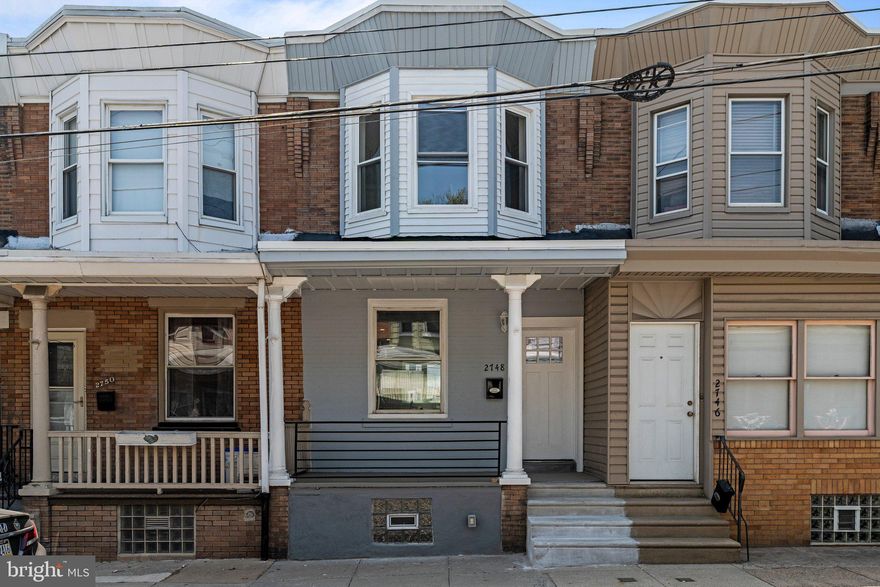 Welcome to your dream home, nestled in the lively Bridesburg neighborhood of Philadelphia! Just minutes away from Route 95, this fully rehabbed house offers the perfect blend of city accessibility and residential charm.

Step onto the inviting open porch, boasting excellent curb appeal that hints at the delights waiting inside. The main level dazzles with a seamless open concept design featuring new hardwood floors and recessed lighting. The heart of this home is undoubtedly the magnificent kitchen, complete with multi-tone cabinets, sleek quartz countertops, and stainless steel appliances, all bathed in natural light.

Every detail is thoughtfully crafted, from the new metal railings and exposed brick accents to the large pantry and coat closet. These features flow effortlessly into an expansive yard, ideal for both relaxation and entertainment.

Upstairs, two stylish bedrooms offer serene retreats with continued hardwood elegance. The large bathroom is a masterpiece of design, featuring custom tile flooring, a spacious vanity, and a luxurious tub perfect for unwinding.

The fully finished basement presents versatile space that can morph into an office or family room. Added conveniences include a half bathroom and a space-saving washer/dryer. Freshly installed roofing and heating, ventilation, and air conditioning systems ensure peace of mind, underpinned by all necessary permits for your assurance.

Located near top local amenities such as Franklin Towne Charter High School, Bridesburg Park, and the ShopRite of Aramingo Avenue, this home is more than just a place to live—it's a lifestyle waiting to be embraced. Why just read about it when you could live it? Come, see, and claim your new beginning!