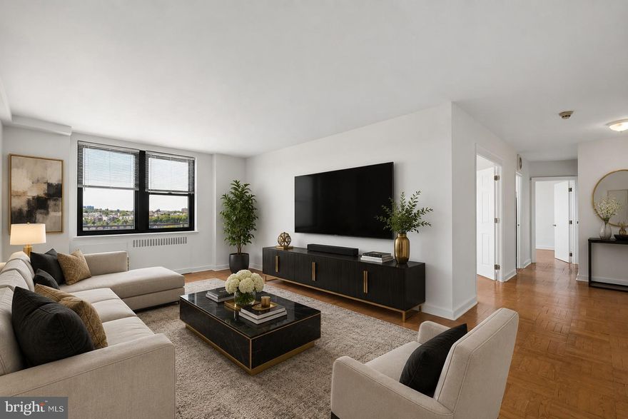 Experience sophisticated urban living in this coveted two bedroom residence at 2601 Parkway, offering sweeping views of the historic Philadelphia Museum of Art and city skyline. Boasting nearly 1,000 square feet of beautifully appointed space, this exceptional home features an open layout with sun-drenched southern exposure. The expansive living area showcases gleaming hardwood floors and oversized windows that fill the home with natural light, creating an ideal setting for both entertaining and everyday living. The modern kitchen delights with abundant cabinetry, upgraded flooring, and premium appliances including a four-burner gas range and dishwasher. The spacious primary bedroom offers an oversized closet and unobstructed Parkway views, while the second bedroom is generously sized with ample storage and could also serve as an office or work from home space. The bathroom features ceramic tiles, polished chrome fixtures, and a storage vanity. An in-unit washer and dryer, additional closets, and thoughtful details complete this desirable residence. Condo fees include gas cooking, water, sewer, shuttle service, fitness center, and 24-hour lobby attendant. Ideally located across from the Art Museum and Fairmount Park, this pet-friendly residence is just steps from Kelly Drive, Boathouse Row, Whole Foods, Target, the Barnes, restaurants, and major transportation.