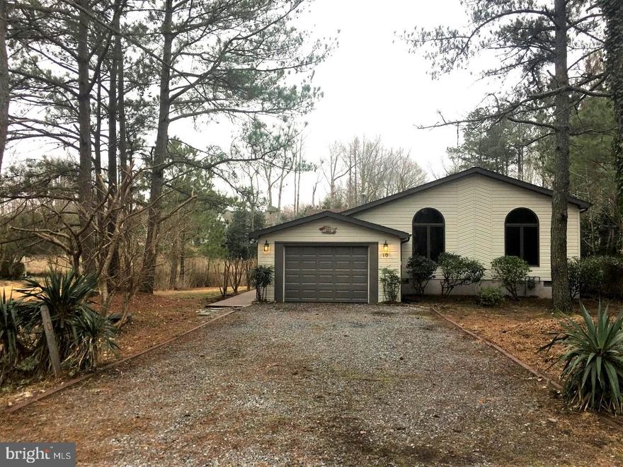 Beautiful, peaceful creekside views East and West - bring your kayak/canoe  and launch from your private pier/dock or just enjoy from the deck , 3 Season room or Living Areas of this updated home. Oak Floors throughout the Living area, kitchen and hall have been reconditioned. The entire home has been freshly painted - including the kitchen cabinets and bath vanities. New carpet installed in all 3 bedrooms. Skylights add natural light  to kitchen and baths and cathedral ceiling and glass windows allow the natural scenery to 'shine thru'.  Garage and Landscaping added bonus!
