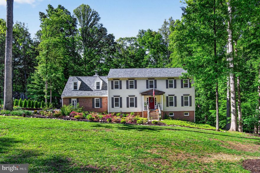 Tucked away on over an acre of private land in Fairfax Station, this beautifully refreshed home offers the perfect blend of tranquility, luxury, and convenience. Surrounded by expansive green space in both the front and back, newly done landscaping, the property delivers a peaceful, secluded setting with picturesque wooded views.

Designed for both everyday comfort and unforgettable entertaining, the home features an extended TREX deck that spans much of the rear of the house, overlooking the private backyard and woods. A rain guard system allows you to enjoy the covered patio below even on rainy days, while the recently added gas hookup for the outdoor grill makes hosting effortless throughout the spring and summer seasons.

Inside, the home has been extensively updated with fresh paint, stylish fixtures, upgraded finishes, and beautiful new landscaping. The heart of the home is the impressive kitchen featuring a large quartz island, ideal for gathering and entertaining. Elegant touches continue throughout, including hardwood flooring on the main and upper levels, a striking ledger stone fireplace, and natural light throughout the home.

The spacious primary suite serves as a true retreat with its own fireplace, sitting area, and bathroom complete with a large shower and standalone soaking tub under a skylight. The finished basement adds incredible flexibility with a newly built kitchenette featuring a full-size refrigerator, fireplace, and recreation area — perfect for guests, multigenerational living, entertaining, or potential rental opportunities — along with a separate 2-in-1 washer and dryer. The newly epoxied garage adds both style and functionality, complete with built-in tool storage and a workbench, creating the perfect setup for hobbies, projects, and organized storage.

Major recent upgrades provide peace of mind, including:

New Roof (2024)
Windows Replaced (2023)
Extended TREX Deck (April 2024)
Hot Water Heater Replaced (September 2024)
Well Water System Replaced (September 2025)
Basement Kitchenette Added (2024)

Additional upgrades can be found in the additional documents.

This exceptional property combines privacy, thoughtful upgrades, and refined indoor-outdoor living in one of Northern Virginia’s most desirable settings — just minutes from Fountainhead Regional Park, Occoquan, Occoquan Regional Park, Burke Lake Park, and Burke Lake Golf Center, the Lorton VRE, and the Shoppes of Lorton Valley, and Liberty Market.