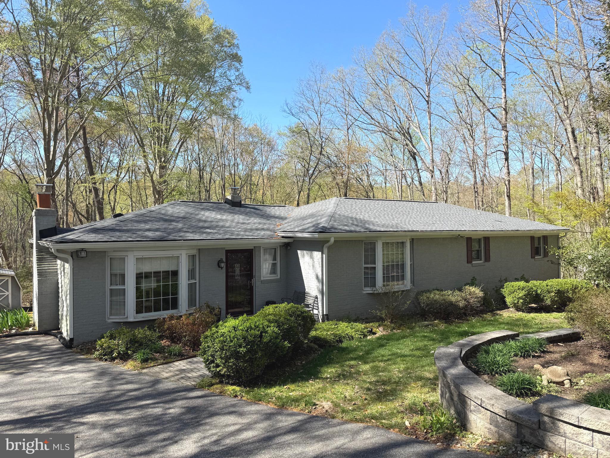 Privacy Abounds on 4.25 Acres at the End of a Cul-de-Sac!
This charming 3-bedroom, 2-bath rambler offers peaceful living surrounded by nature. Nestled at the end of a quiet cul-de-sac on a spacious 4.25-acre lot, this home boasts a beautifully updated kitchen with newer appliances—perfect for everyday meals or entertaining guests.
Enjoy the outdoors from your screened-in porch, an ideal spot to relax and soak in the privacy. The primary suite includes its own en suite bath, offering a private retreat.
Inside, you'll find a large recreation room with a cozy fireplace, along with a separate family room—plenty of space for gatherings or quiet evenings at home.
Roof is 1 year old