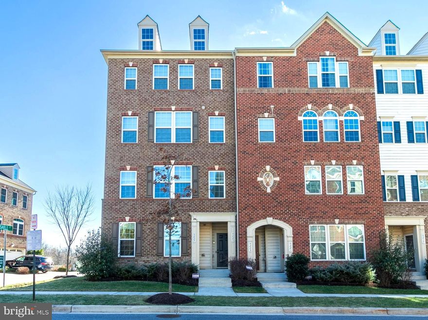 Stunning condo in Greenbelt Station with a designer feel! This  updated  charmer  is beyond move in ready! The open concept kitchen and living room offer recessed lighting, gorgeous solid surface flooring, a stylish half bath and a fireplace/TV feature wall.  Upstairs you'll find a roomy primary suite with a walk in closet, two more bedrooms,  one with a mounted theater screen! New hardwood floors on the stairs, hallway and primary suite.  The garage is conveniently located in the rear of the home with kitchen access.  Parks, a playground and walking paths are nearby.  Central to everything  with Lake Artemesia, shopping and restaurants all located within a mile. UMD and the Metro are less than two miles away!  This one will go quick so reserve your showing today!