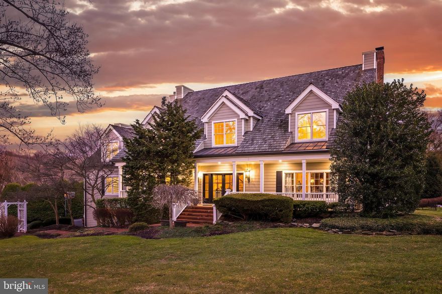 Introducing 539 Springvale Road in the heart of Great Falls. This picturesque cape cod is situated on 2.36 beautifully landscaped acres with a dream backyard pool, extensive hardscaping and custom interior details. Nestled against a delightful pond, each room in the back of the house enjoys serene views of its natural backdrop. Vacation at home with a stunning heated swimming pool, hot-tub, built-in BBQ grill and fire pit area. Meticulously maintained with new HardiePlank siding, cedar shake roof, and a renovated kitchen, primary bathroom, and lower level. 

Inside you are greeted by classic charm with gleaming hardwood floors, molding and trim, built-ins and 9'+ ceilings. The main level includes a formal dining room, sitting room, and a grand 2-story family room with ample sunlight, a beamed ceiling, and cozy brick mantel fireplace. The eat-in chef's kitchen features a center island, perfect for gatherings, and top of the line appliances. Double access from the kitchen to the covered decks with ceiling fans and views of the backyard oasis. The main level also offers a private primary bedroom and its spa-like en-suite bath. Delight in the sunlit 2-story bath with a vaulted ceiling, a double sided gas fireplace and centerpiece soaking tub. His-and-hers walk-in closets are custom built with shelving and drawers. Charming spiral stairs take you up to a loft area with a cedar closet and additional storage space. Plenty of room to customize this space to fit your needs - make this your home office, a yoga room, or a private space for respite. Three generous bedrooms upstairs all include en-suite baths and inviting dormer windows. The upper level landing has gorgeous built-ins and offers optional space for a home office or library. Tailor the second loft area as a 6th bedroom or a bonus playroom! The walk-out lower level is completed with a wet-bar which houses a wine fridge, and is perfect for family movie or game nights. A full bedroom and bath are perfect to use as an in-law suite or for overnight guests. 

Enjoy a spacious three-car garage and plenty of available parking in the driveway which is accessible by Down Patrick Lane. Located in the desirable Langley High School pyramid and minutes to Tysons Corner, I-495 and the GW Parkway, this is true lifestyle property in the heart of Great Falls. Welcome home!