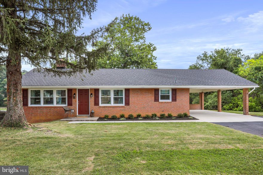 Welcome to this beautifully renovated ranch-style home, conveniently located on a large corner lot. This charming brick residence features 3 bedrooms and 2 full baths, offering ample space for comfortable living. The main level boasts a desirable layout, including a convenient laundry area. Step inside and be impressed by the stunning updates throughout. The home showcases a brand new roof, HVAC system, windows and doors, ensuring energy efficiency and peace of mind. The modern LVL floors add a touch of elegance and durability to the living spaces. The kitchen is a chef's dream, with newly installed cabinets, quartz countertops, and top-of-the-line appliances. The adjacent dining area is perfect for gathering with loved ones. Relax and unwind in the master suite, which includes a custom tile shower in the ensuite bathroom. Two additional bedrooms provide versatile space for guests, a home office, or hobbies. The second full bath is also totally updated. The basement features a finished recreation room, complete with a cozy fireplace, offering an ideal space for entertainment or relaxation. Outside, the carport provides convenient covered parking for your vehicles. This home's location is a true asset, with easy access to schools, shopping, and just minutes away from I-66, providing a smooth commute to nearby areas. The large corner lot provides ample outdoor space for activities and potential landscaping opportunities. Don't miss the chance to make this completely renovated ranch-style home yours. Schedule a showing today and experience the comfort and convenience this property has to offer!"