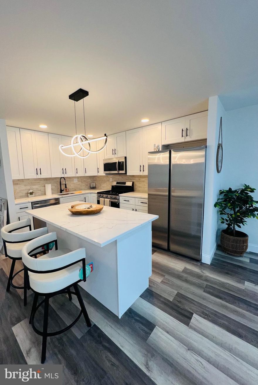 Welcome to your dream home in the desirable Parkwood neighborhood!This beautifully remodeled and move-in-ready townhouse offers modern upgrades, stylish finishes, and an open layout designed for comfort and functionality. Step inside to a spacious and sun-filled living and dining area, enhanced by modern lighting fixtures and sleek vinyl flooring throughout. The heart of the home is the custom-designed kitchen featuring crisp white 42-inch cabinets, quartz countertops, a large center island, and premium Samsung appliances—ideal for both everyday living and entertaining. The main floor features two bedrooms and beautifully updated full bathroom,  while the lower level includes an additional bedroom, a powder room, living space, laundry, and garage. The fully finished basement offers even more living space with a cozy family room, a versatile additional bedroom or home office, a stylish powder room, and a dedicated laundry/storage area with washer and dryer. Walk out directly to the large, fenced backyard—perfect for outdoor relaxation! Situated just a few blocks from shopping, dining, and public transportation, and offering easy access to Route 1, I-95, the PA Turnpike, and nearby commuter train stations, this home truly has it all.
Don’t miss your opportunity to own this stunning and versatile property in one of Northeast Philly’s most sought-after communities. Schedule your showing today!