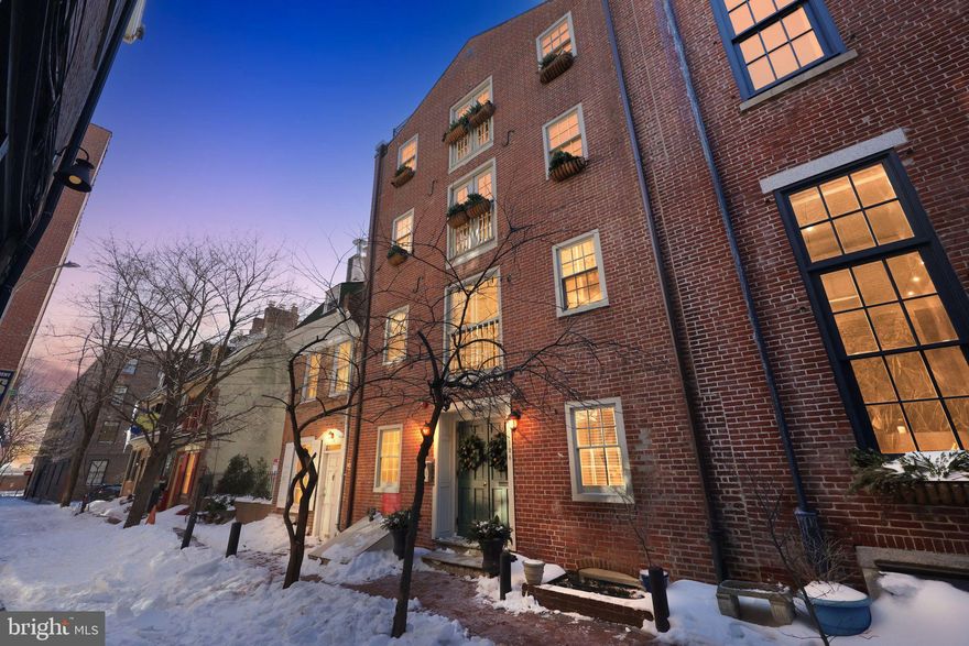 Welcome to this stunning full-floor, two-bedroom, two-bathroom residence (approx. 1700 square feet) in an exclusive six unit boutique building tucked along a quiet cobblestone street in the heart of Old City. Perfectly situated just steps from great coffee shops, acclaimed restaurants, fitness studios, and stylish boutiques, this home offers a serene retreat while placing you in the center of everything Old City has to offer. From the secure lobby, the elevator opens directly to your private residence. Enter through the foyer with a Juliet balcony and past a large coat-closet into the expansive living room featuring handsome wood floors, recessed lighting, and a cozy gas fireplace which sets the tone for both entertaining and everyday living. The office walls are complete with built-ins which add a warmth and richness to the room, making it a perfect location for working from home. Proceed into the gourmet chef-inspired kitchen featuring custom cabinetry, gleaming granite countertops, stainless steel appliances, and an island, with seating, that seamlessly connects to the bright open-concept dining and living areas. The guest bedroom is spacious and inviting with a view of the private courtyard. A full bathroom with a vanity sink, ceramic tile and shower/tub enclosure is located right outside the guest bedroom entrance. The primary suite is a true sanctuary, offering a generous walk-in closet with custom built-ins and a spa-like marble bathroom with dual vanities, frameless glass shower, soaking tub and radiant heated floors.  There is an opportunity to rent a one car garage parking space - off site-right across the street (at The National Condominium) for an additional monthly fee.  An exceptional opportunity to own a refined residence in one of Philadelphia’s most historic and vibrant neighborhoods. A walkers and bikers paradise!