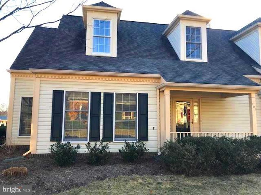 Bright & Beautiful ! Volume Ceilings. End unit townhome boasts spacious living & dining spaces anchored by gas fireplace.  Bright kitchen with breakfast bar. Main level laundry.  Powder room for guests. Main Level Master Bedroom with walk-in closet; Master bath with soaking tub and separate shower.  Second master bedroom upstairs with full bath. Storage. Covered parking + guest parking.