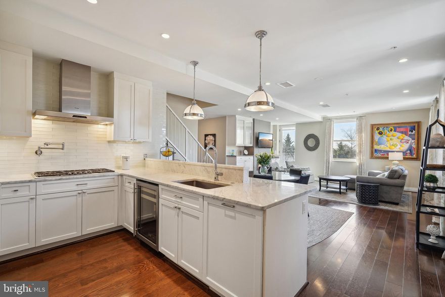 Located in the prestigious Georgetown neighborhood, within the boutique condominium building known as The Montrose, this rarely available and exquisite corner unit boasts three bedrooms, three and a half bathrooms, four parking spaces, Washington Monument and Kennedy Center views, and privacy. From its spacious, sunlit rooms to its high ceilings and refined finishes, including Waterworks bath fixtures, this home exudes quality. An interior full-sized elevator adds convenience, effortlessly connecting both levels within the home. A balcony off the study invites you to enjoy a breath of fresh air and soak in the surrounding ambiance.  This corner unit, with windows on three sides, maximizes sunlight and views.  The unit has the right combination of solid historic architecture combined with updated modern interior.
Upon entry, the handsome foyer sets the tone for the residence. A gracefully proportioned living and dining area, adorned with a modern gas fireplace and bespoke built-in bookshelves, awaits. Large windows allow natural light to flood the space. The adjacent kitchen, adorned with sleek white cabinetry and Carrara marble countertops, is equipped with premium appliances, including a wine refrigerator, and abundant storage, creating a culinary oasis for the discerning chef. The first of two Primary Suites can be found on the main level with a large walk-in closet and private full bath with heated floor.
 Ascend to the second level where a charming study and seating area can be found, featuring custom built-ins, including a wall of bookshelves, a built-in desk and large storage cabinets, making it a convenient spot to work from home. The study also features a large private balcony where you can enjoy the view. The Second Primary Suite features a walk-in closet and luxurious bathroom with heated floor and skylight. A third bedroom and full hall bath with skylight provide flexible living options to suit your lifestyle.
 Additional features include a main level laundry room and powder room, abundant closet space throughout, and access to two secure storage areas. Featuring four reserved parking spaces in a gated area, ensures hassle-free parking for you and your guests alike.  Unlike much of Georgetown, the quiet residential location makes it easy to have additional guests park on R Street in front of the building. 
Step outside to discover the serenity of the building's manicured grounds, complete with winding paths, seating areas, a communal herb garden, and a dedicated grilling area. Pet-friendly and welcoming, this tranquil enclave offers a peaceful retreat like no other in the midst of urban life, with the lush greenery of the 16-acre recreational Montrose Park and Dumbarton Oaks located across the street. Located just steps away from everything you love in Georgetown. The monthly condo fee covers among other things, electricity for heating and air conditioning, as well as gas for hot water, cooking, and the fireplace.