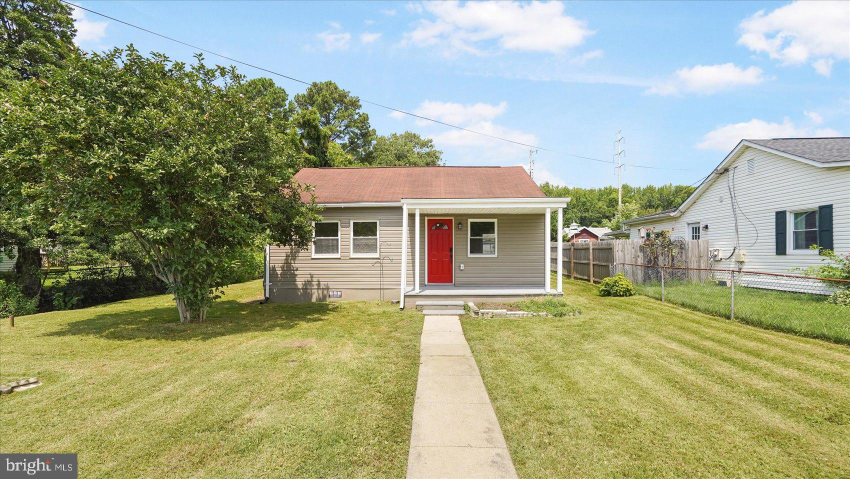Adorable move-in ready and newly renovated 2BR/1BA Cottage located on a pristinely maintained lot in a quiet neighborhood. Make your way through the gated front yard on the way to the covered front porch of your new home. Step inside a home filled with natural light, hardwood floors, a soft color palette, and recessed lighting. The main living areas consist of a spacious living room and eat-in kitchen. The kitchen boasts mixed metal featuring gold accents with stainless steel appliances, cabinets to the ceiling, sleek quartz countertops with a complimenting tiled backsplash, and plenty of room for a breakfast table. Down the hall is a sizable secondary bedroom, a spacious primary bedroom, and a newly remodeled full bath with the classic black and white tile. From the kitchen step outside to an oversized wood deck that overlooks a yard filled with green space and so many possibilities. This home is ideal for any new homeowner and is located in close proximity to shopping, restaurants, and commuter routes.