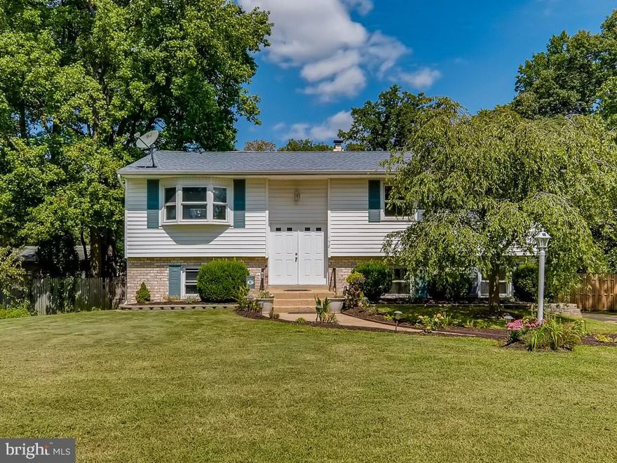 PRICE REDUCED!  This Campus Green home has 5 spacious bedrooms, 4 full baths and approximately 3300sf of Finished living space.  It features 3 bedrooms with en-suite bathrooms...choose your Primary suite!  The 5th bedroom in the lower level could also serve as a nursery or be converted to a large walk-in closet for a  2nd Primary bedroom or In-law suite. The oversized eat in kitchen has been updated with stainless steel appliances and opens to the deck overlooking the swimming pool and large backyard.  The lower level family room features a beautiful brick fireplace, vaulted ceilings, and a rough-in for a wet-bar or small kitchenette.  With this large fenced in backyard,  you won't need to leave your home to go on vacation.  It's perfect for entertaining friends, family, or pets!  The concrete inground pool has recently received a major renovation including new plaster, pool pump, filter, pipes, safety pool cover and  glass tile waterline/border.   Trampoline with Camping cover and playset Coveys! Roof 2018. Hard wired Home Generator.   The Campus Green community is a short walk or bike ride to Anne Arundel Community College and Twin Oaks Park.  It's conveniently located within 5miles of Rt. 50 and 1 mile of RT. 2 making commutes to DC, Forte Meade, Annapolis and Baltimore effortless.  The Broadneck Park is approx. 3 miles away and includes a new pirate ship playground, ball fields, and a dog park.  A feasibility study is underway for phase III of the Broadneck Trail which is projected to ultimately cover 9-mile stretch parallel to College Parkway from Bay Head Road to Ritchie Highway.  Hall bathroom has been updated with new tile and vanity since photos!