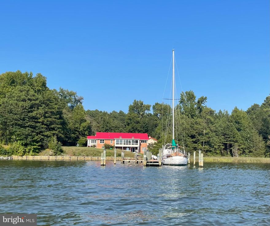 Welcome to your own waterfront retreat in Lancaster, Virginia. Located well above sea level on secluded 6.4 acres along the Western Branch of the pristine Corrotoman River. This beautifully renovated home offers deep water with access to the Chesapeake Bay and a lifestyle of comfort, privacy, and recreation. Completely updated from top to bottom, the home features new roof, chef’s kitchen, new kitchen appliances, luxurious bathrooms, spacious walk-in closets, new Andersen windows, new frontdoor, and freshly painted interiors. Step inside to an open-concept waterfront living area with gleaming hardwood floors and sweeping river and sunset views. Outside, enjoy 147 feet of water frontage with a 200 foot pier designed for serious boating and leisure. It accommodates two deep-keel sailboats, a powerboat lift (10,000 lbs capacity), and a Sea-Doo Speedster lift. Ample parking and storage abound with a 50 amp RV hookup, six parking spaces outside, an oversized three car detached garage, and a two car attached garage providing room for serious car collectors, and every interest and adventure. This home also comes with a 25K Generac Generator with a 1,000 gallon tank of propane. High speed internet is provided by All Points Broadband. Two additional buildable lots also included with this property. Spend your days boating, fishing, crabbing, or harvesting oysters, and your evenings stargazing while watching deer, eagles, and ospreys in the backyard. Experience the very best of the Northern Neck waterfront lifestyle where every day feels like a getaway and the conveniences of Kilmarnock and Irvington are just moments away. Owner is the listing agent.
Directions: From Kilmarnock: Head east toward VA-3/N. Main St., Turn left onto State Rte 604/Merry Point Rd., Turn right onto State Rte 611/Hoecake Rd., Turn left onto Woodbrook Dr., House is on the right with the sign at the driveway.
