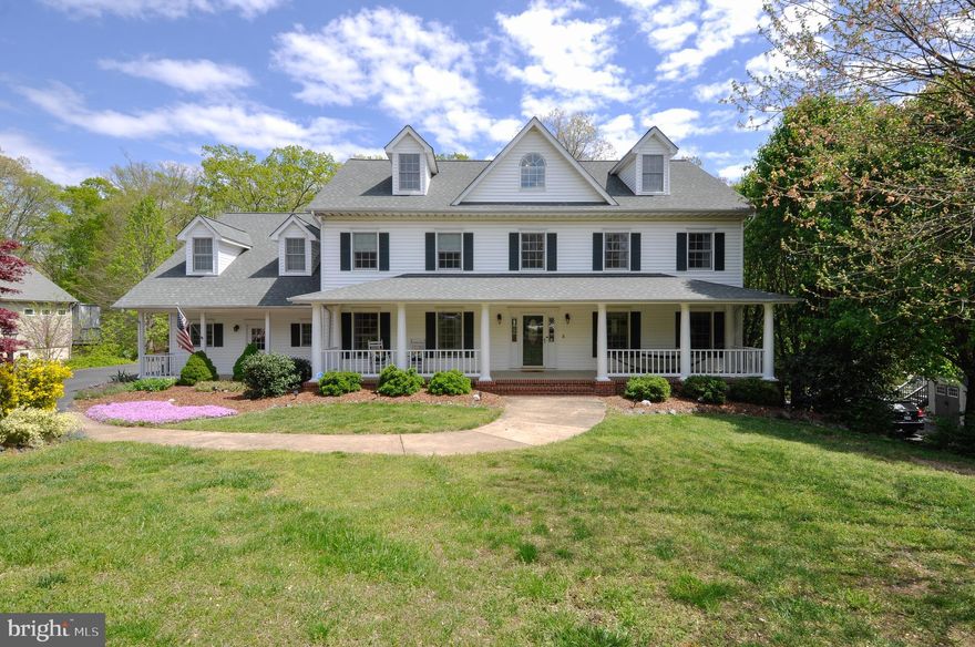 This custom residence has the spacious and private setting of a country estate combined with the convenience of city living. Four finished levels offer plenty of private space for a large family, multi-generational living, home office, etc. The lower level features a full apartment suite with living room, full kitchen open to a dining area, bedroom, sunroom, full bath and one-car garage. Great for in-laws, a nanny or young adult children still living at home. The main level provides an open floor plan that is an entertainers dream. The upgraded kitchen has upscale appliances, granite countertops, a center island and two pantries. The second level features five bedrooms and three full bathrooms. The master suite includes a gas fireplace, an envious double walk-in closet and a renovated bathroom that feels like you re stepping into a spa. The fourth level includes two additional bedrooms and the fifth full bathroom. This bonus space could also allow for a home gym, craft or game rooms, etc. Maintenance-free decking extends across the rear and overlooks the private, fenced rear yard that backs to trees. A full covered porch extends across the front of the residence and overlooks the private cul-de-sac setting. The two-car, side-loading garage completes this one-of-a-kind offering located just minutes to downtown Fredericksburg, Central Park, I95, Mary Washington Hospital, UMW and much more.