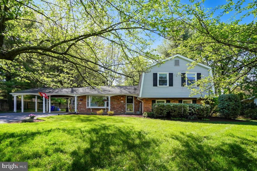 Motivated Sellers moving out of state! Stunning single-family home in desirable Olney! Situated on an expansive .53-acre lot, offering over 2,100 square feet of living space. The main level boasts a spacious eat-in kitchen, thoughtfully upgraded with gleaming stainless-steel appliances, exquisite butcher block countertops, and abundant new grey cabinetry. The adjoining eat-in area provides convenient access to the double carport, while the formal dining room, adjacent to the kitchen, sets the stage for seamless entertaining. Bathed in natural light, the inviting living room features a sliding glass door that opens onto the expansive new deck, overlooking the sprawling fully fenced backyard—a perfect oasis for outdoor gatherings and relaxation. The upper bedroom level hosts four generously sized bedrooms and two beautifully appointed bathrooms. The primary suite is complete with double closets and an ensuite bath featuring a stunning walk-in glass and tile shower. The secondary bedrooms offer ample space and share a full bath adorned with updated vanity and tilework. The lower level of the home is a versatile space, fully finished and boasting a walk-out to the backyard. Here, a cozy family room awaits, adorned with floor-to-ceiling built-ins and a charming wood-burning fireplace. Additionally, this level includes a convenient half bath and a laundry/storage room for added functionality. Conveniently situated just steps away from local shops and restaurants, this home offers easy access to major commuter routes, including the ICC, and public transit options. Families will appreciate its proximity to schools and local parks, providing endless opportunities for recreation and community engagement. Don't miss out on the chance to call this exceptional property home—schedule your showing today!