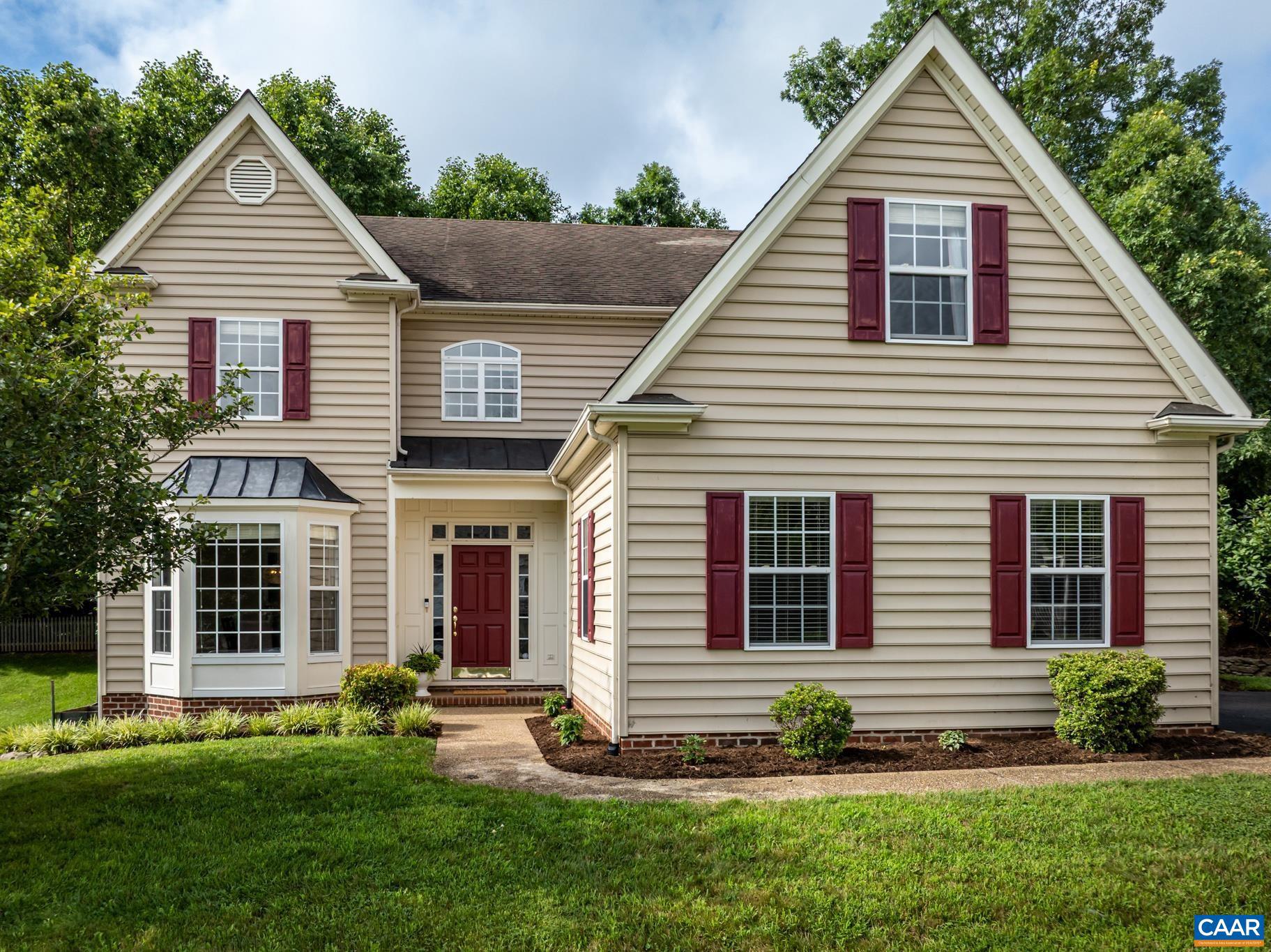 This lovely colonial is nestled in Crozet's desirable Grayrock neighborhood. It boasts five bedrooms, three and half baths and mountain views. On the main level, you will find the foyer, dining room, kitchen, breakfast nook, laundry room, half bath, one of the primary bedrooms, and a large great room with vaulted ceilings and a gas fireplace. The second level offers the second primary bedroom and 3 additional bedrooms. One of the bedrooms is currently being used as a playroom/office. This home has tons of built-ins and lots of closet space. There is a charming backyard with a patio, pretty landscaping, and a newly installed wooden fence. Grayrock has two ponds and two playgrounds to enjoy. Downtown Crozet, vineyards, orchards, trails, and I-64 are within close proximity.,Painted Cabinets,Fireplace in Great Room