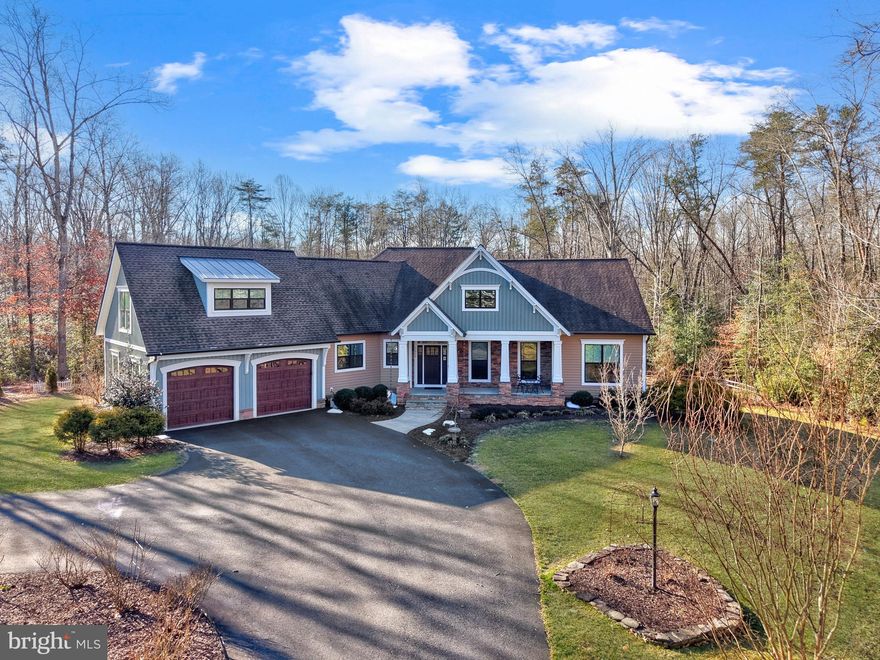 Welcome to 7026 Barclay Drive, a stunning Craftsman-style retreat nestled in the coveted River Glen community of Fredericksburg. Set on a lush two-acre lot, this 2016-built home by J. Hall Homes blends high-end comfort with everyday functionality, offering 4,560 square feet of beautifully designed living space.


From the moment you pull up the long, tree-lined paved driveway, you’ll notice the striking combination of stone, and vinyl siding that gives this home its timeless curb appeal. Step inside to find an airy, open floor plan highlighted by elegant coffered ceilings, reclaimed hardwood floors, and abundant recessed lighting. The heart of the home is the expansive family room, complete with a built-in entertainment center and stylish barn doors, making it the perfect spot for relaxing evenings or hosting friends.


The main level is designed for convenience, featuring three bedrooms, including a primary suite with a spa-like bath, and a bonus room near the entry that could function as an office, formal living room, or additional bedroom. 


The gourmet kitchen seamlessly flows into the dining and living areas, and features a large island, granite countertops, white cabinets, a combination convection/microwave oven, a propane range, a farm sink, and butlers pantry. You will appreciate the large walk-in pantry with extra storage. From the adjacent eat-in kitchen a french door leads to the spacious screened porch..


The primary suite offers a cozy retreat with an extra deep tray ceiling, crown molding, lots of windows facing the wooded backyard, and remote controlled custom blinds. The primary bath features gorgeous tiles throughout, two large sinks with extra storage areas, a large soaking tub, walk-in shower and a huge walk-in closet. The rest of the main level contains two additional spacious bedrooms, a full bath,  a powder room, huge laundry room, and mud room leading to the spacious two-car garage, featuring a durable polyaspartic floor. A beautiful oak staircase leads to the upper level, where an expansive loft with LVP flooring provides an additional cozy retreat in addition to another bedroom and full bath. 


The lower level is an entertainer's dream, with a huge family room and wet bar, a full bath with a walk-in shower and a large bedroom. A french door leads to the lower deck. There is even a large unfinished area for storage or additional expansion. The wooden shelves convey. The water softener was installed in 2020, all other equipment is original to 2016. F


If you love the outdoors, you’re in for a treat. The backyard is an entertainer's dream, featuring a 16x20 screened-in porch with Trex flooring, a 16x24 lower deck with a 14x14 wooden pergola, and an outdoor flagstone patio with a custom firepit, all overlooking a beautifully landscaped garden with vibrant flowers backing to woods.. 


Located just five miles from the shopping and dining at Central Park and served by the Riverbend High School district, this Energy Star certified home offers both a private sanctuary and easy access to local amenities. It’s more than just a house; it’s a place where you can truly settle in and enjoy the best of Virginia living. Don’t miss this rare opportunity to own a home in this highly coveted community.