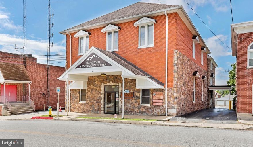Updated Second Floor office in Downtown Boonsboro with elevator access and off-street parking. This 1,000 sqft office space is fitted with reception desk and waiting area, 3 offices/patient rooms, storage, bathroom and break-room area with sink. Ideal situation for a mental health, physical therapy or medical professional looking to network with the existing practices in the building. The floor plan lends itself to other professional service businesses looking for the convenience of a location close to both Frederick and Hagerstown and I-70.  Charming Boonsboro and the surrounding area offers a diverse client/customer base for your business and the building is easy to find for delivery services and diagnostic pick-ups. The town offers several high quality restaurants, a Gourmet Coffee shop- Stone Werx, banks, gas stations, Fast food options, grocery and other points of cultural, economic and historic interest.
The base rent of $975.00 each month does not include the Elevator Service Fees and Common Area Maintenance Fees which are $225 per month. Tenant is responsible for their own Internet, Electric, Cable, Insurance and, the water and sewer proration.