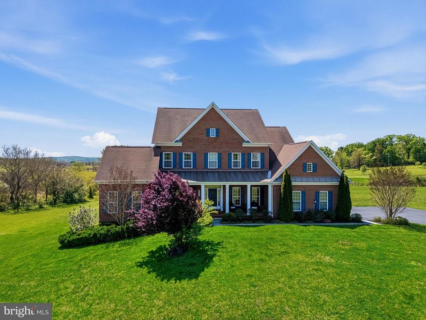 A PRIVATE FIRST LEVEL IN-LAW SUITE sets the tone for this exceptional home, offering rare flexibility for multi-generational living, long-term guests, or anyone who values a true main-level retreat. Complete with its own full bathroom and excellent separation from the home’s main living areas, this suite provides comfort, privacy, and convenience in a way that is increasingly hard to find.

Set at the end of a quiet cul-de-sac with a uniquely private approach, this residence offers over 6,000 square feet of living space on more than three flat acres. The main level is anchored by a massive family room filled with natural light from large windows and enhanced by a dramatic beamed ceiling. The adjoining gourmet kitchen features granite countertops, custom cabinetry, and a large center island, creating a natural gathering space for everyday living and entertaining. Just off the kitchen, a bright sunroom surrounded by oversized windows adds another inviting space to relax and enjoy views of the property.

Outdoor living is equally impressive, with a composite deck overlooking the expansive, level acreage — ideal for dining, entertaining, or simply enjoying the privacy of the setting.

Upstairs, a second primary suite provides another private retreat, featuring a spacious bedroom and an impressive primary bathroom with a massive walk-in shower. Two guest bedrooms share a Jack-and-Jill bath, while an additional guest bedroom includes its own private bathroom, giving the upper level a thoughtful layout with excellent separation and convenience.

The walk-out lower level expands the home even further, offering abundant natural light, a large recreation room, a full bathroom, and generous storage space. Whether used for entertaining, hobbies, fitness, media, or guest overflow, the lower level adds meaningful flexibility to an already spacious floor plan.

Outside, the setting is what truly separates this property. More than three flat acres provide room to spread out, play, garden, entertain, or simply enjoy the privacy of a large homesite. With a cul-de-sac location, exceptional separation, and a rare sense of privacy, this home offers a unique combination of space, flexibility, and scale rarely found together.