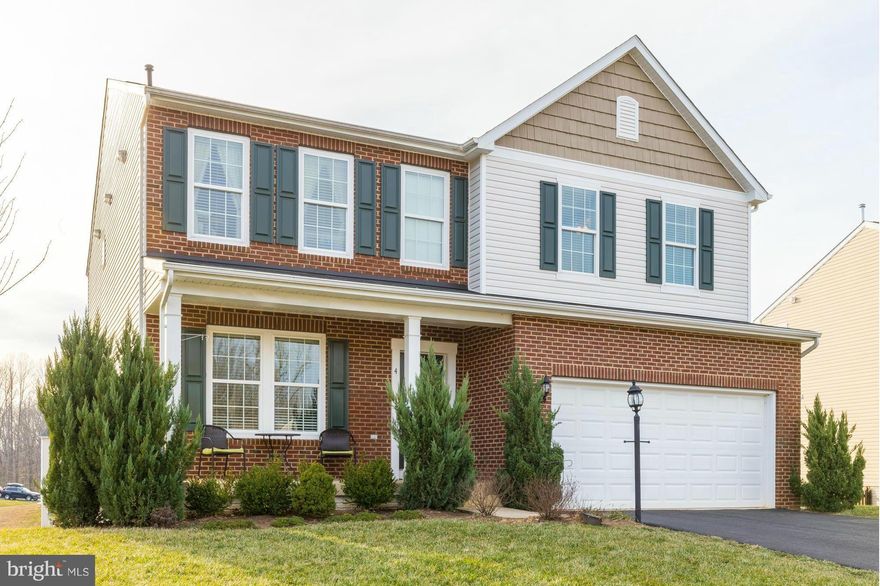 Former model home with almost 4000 sq. feet of living space offering seasonal water view! Gourmet kitchen with granite counters and SS appliances. Master bath offers tiled shower and double vanity.  Walk-out fully finished basement offers 5th bedroom, full bath, large rec room, and lots of extra storage space.  Home has large deck off main level and stamped concrete patio off of basement.