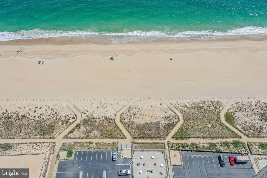 **Multiple Offers- Best and Finals to be submitted by 5pm, Monday-4/24**   
Welcome to The Quay Penthouse - the perfect direct oceanfront end unit location that will take your breath away! Located on the top floor of The Quay condo building, this rare gem offers sweeping views of both North and South Ocean City beaches that seem to stretch on forever.  As you step inside, you'll be greeted by a sense of spaciousness that is hard to find in most condos, thanks to the open floor plan and multi-level setup with high ceilings. The floor-to-ceiling windows let in plenty of natural light, making it easy to soak up the beauty of the sunrise over the ocean. The main floor boasts a generously-sized bedroom with an attached bathroom, while the second large bedroom awaits you upstairs with an attached bath. And if that's not enough, the loft area is perfect for an unofficial third bedroom or an artist's retreat. Well maintained and priced accordingly for the new owner to come put their personalized finishes to make it their own.  The Quay building is immaculately maintained, and the entry lobby area is undergoing a modernization overhaul. You'll have access to an indoor pool, an outdoor pool, sauna, tennis court, a game room, and a fitness center, and 24-hour security ensures your peace of mind while away. Wake up and enjoy a coffee while watching the sunrise on your balcony. Then cruise down the elevator and stroll on over to the beach to relax and take in the sounds of the ocean. Come back up and  take a dip in the outdoor pool. While getting a little sun you realize it is only 9am and what to do next? It's going to be a good day! Don't miss the opportunity to own the ultimate beach condo. Great income potential as a short term rental.   Check out the full video flythrough, and stay tuned for professional photos coming soon!