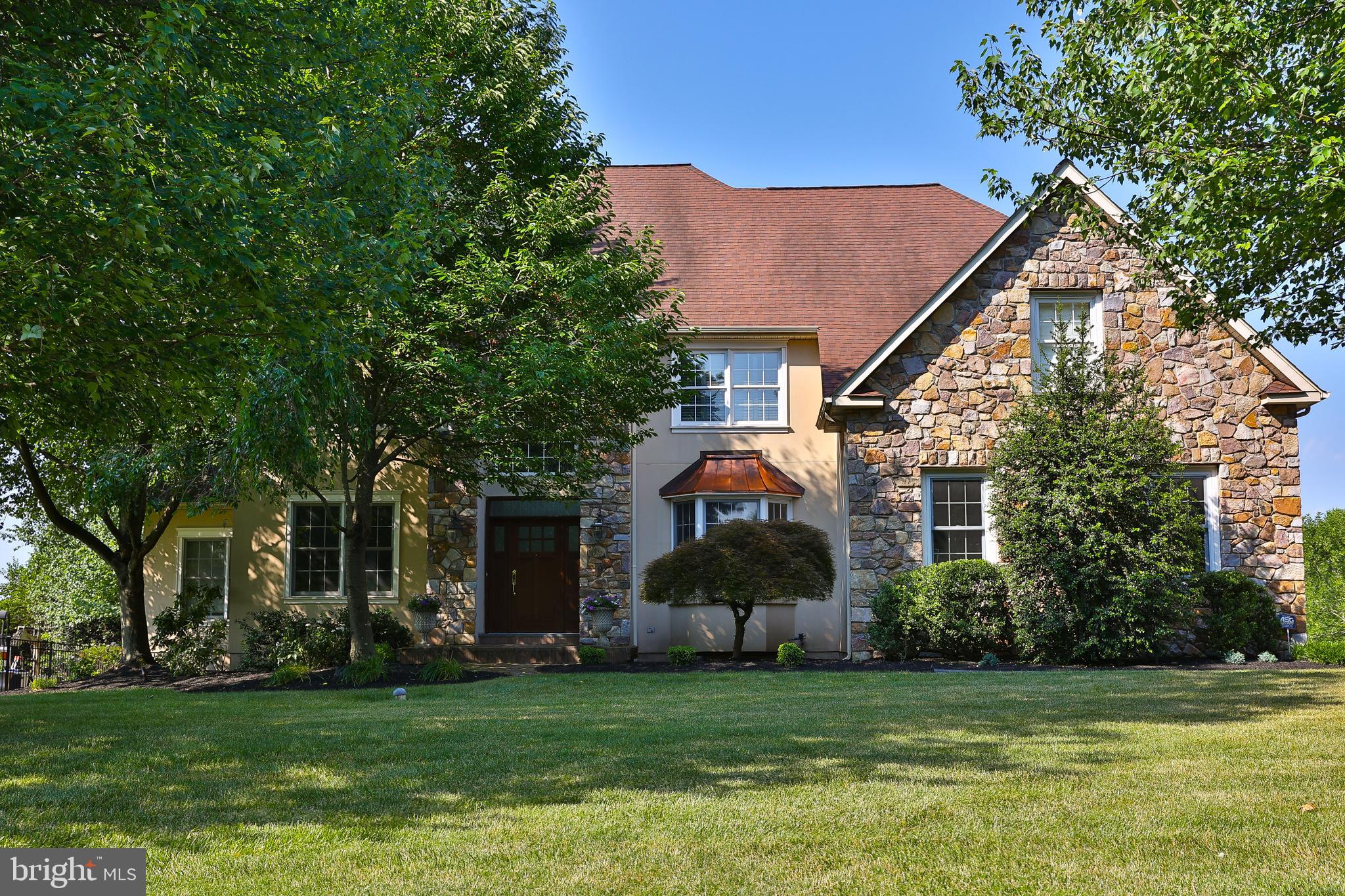 Welcome to this outstanding and incredibly spacious 5 Bedroom, 5 FULL and 1 Half Bath, 3-Story Colonial with a 3-car garage in the highly coveted Normandy at Blue Bell neighborhood with 6800 SF of living space. This home is ideally positioned within the community, backing up to over 12 acres of preserved open space offering a private setting and enough room to test your golf game too. Natural light greets you as you enter the home’s 2-Story Foyer with both formal Living and Dining Rooms flanked on either side featuring 9' ceilings, hardwood floors, and custom millwork, adding to the home's charm. The stunning 2-story Family Room is a showstopper, topped with an incredible Restoration Hardware chandelier and also features one of two gas fireplaces, and connecting to two separate Butler's Pantries, including one with a wet bar. The heart of the home is the spacious Kitchen, complete with a center island, Corian countertops and ceramic tile backsplash. This space opens to a fabulous Sunroom with walls of windows, offering breathtaking views of the deep, beautifully landscaped rear yard. A first-floor office is one of several options for those working from home. The powder room and laundry complete this floor. Two sets of stairs provide easy access to the 2nd Floor, where the luxurious Owner's Suite awaits. This suite features a bedroom with a tray ceiling, and the Sitting Room has been transformed into an amazing walk-in, professionally organized closet with a granite island. Light-filled bathroom includes a tiled shower with a frameless glass door, a whirlpool tub, and a vaulted ceiling. An ensuite bedroom and two additional bedrooms sharing the hall bath with tub-shower complete the second level. The 3rd finished third floor is versatile, serving as a 5th Bedroom, In-Law Suite, or Home Office, with three built-in workstations, a Full Bath, and a separate HVAC zone. One of the major highlights of this home is the recently updated and refreshed finished basement. This exceptional space includes a Recreation Room with gas fireplace, a renovated full bath, an industrial-style Workout Room perfect for fitness enthusiasts, and an additional home office providing the ultimate in convenience and functionality. Additional features include ceiling fans, central vacuum, recessed lighting, and hard-wired speakers in most rooms. A sliding French door from the Sunroom opens to a spacious Trex deck, perfect for outdoor gatherings, overlooking the gorgeous grounds with an in-ground sprinkler system. Located in the top-rated Wissahickon School District, this neighborhood is just minutes from excellent shopping, restaurants, and multiple train stations.
This is truly a one-of-a-kind property offering an unbeatable combination of amenities, functionality, and location. Don't miss your chance to make this stunning home yours!